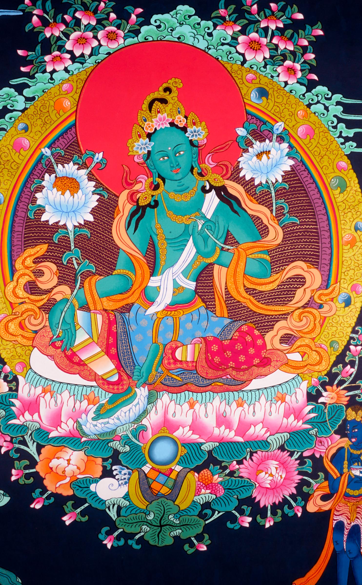 This genuine Tibetan Thangka of Green Tara beautifully captures the goddess of compassion in Buddhist tradition, symbolizing swift protection and loving guidance. Hand-painted using natural pigments, this sacred artwork brings serenity and spiritual energy to any meditation or devotional space.