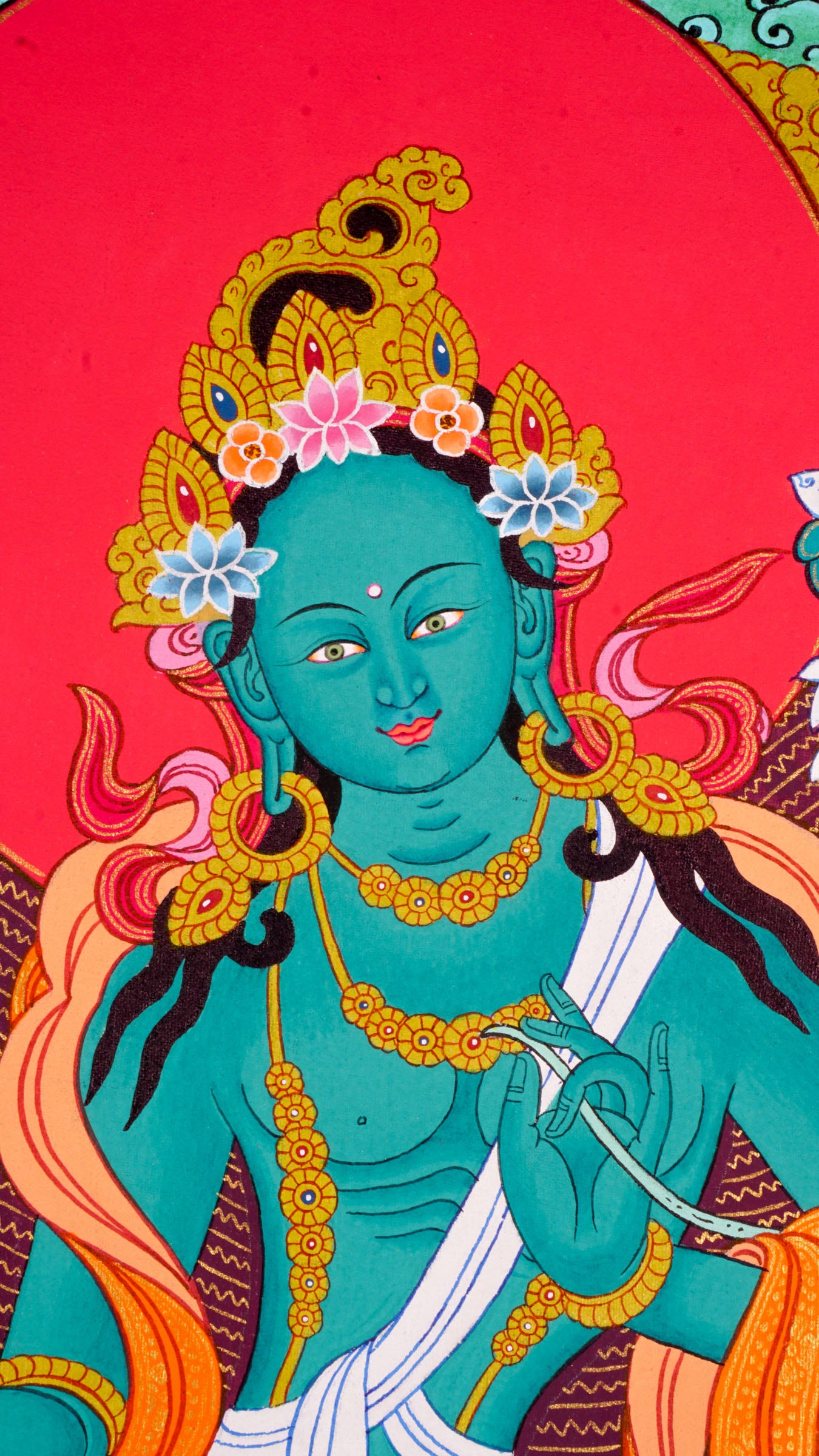 This genuine Tibetan Thangka of Green Tara beautifully captures the goddess of compassion in Buddhist tradition, symbolizing swift protection and loving guidance. Hand-painted using natural pigments, this sacred artwork brings serenity and spiritual energy to any meditation or devotional space.
