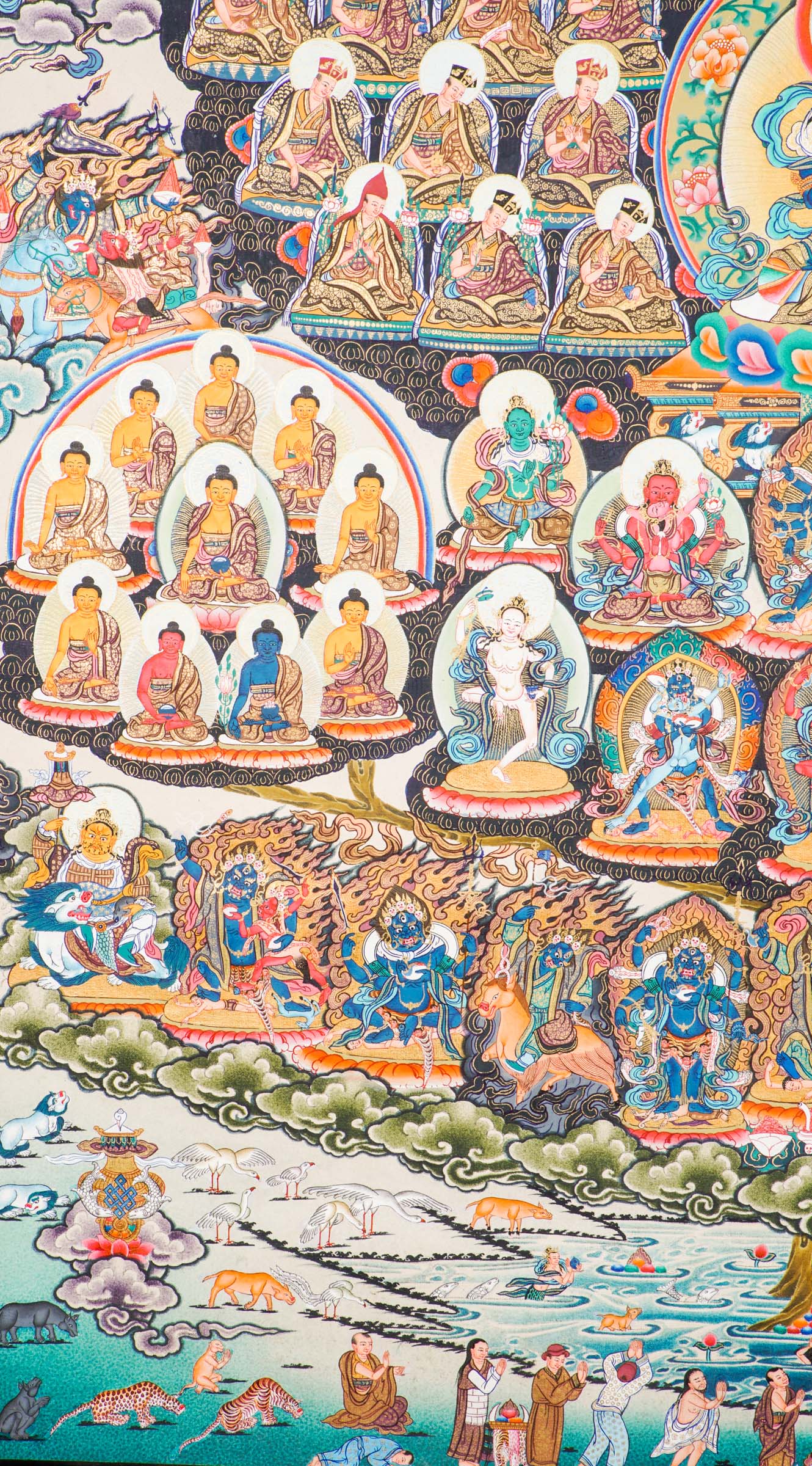Large traditional Tibetan thangka depicting a detailed Buddhist cosmological assembly, with Vajradhara at the center surrounded by numerous Buddhas, bodhisattvas, lineage masters, and symbolic figures arranged in a complex, symmetrical composition.