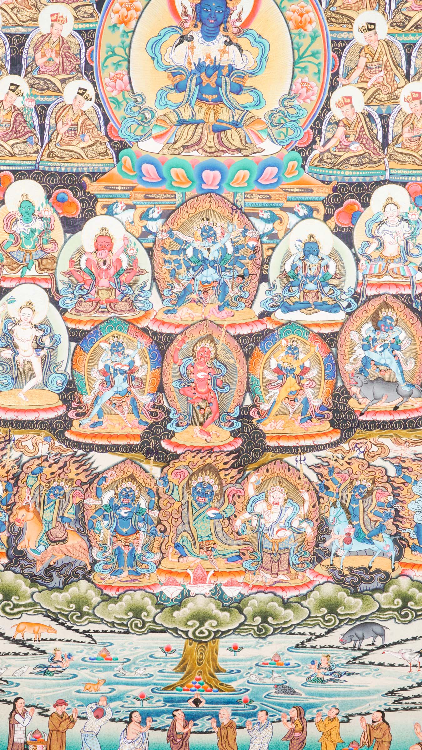 Large traditional Tibetan thangka depicting a detailed Buddhist cosmological assembly, with Vajradhara at the center surrounded by numerous Buddhas, bodhisattvas, lineage masters, and symbolic figures arranged in a complex, symmetrical composition.