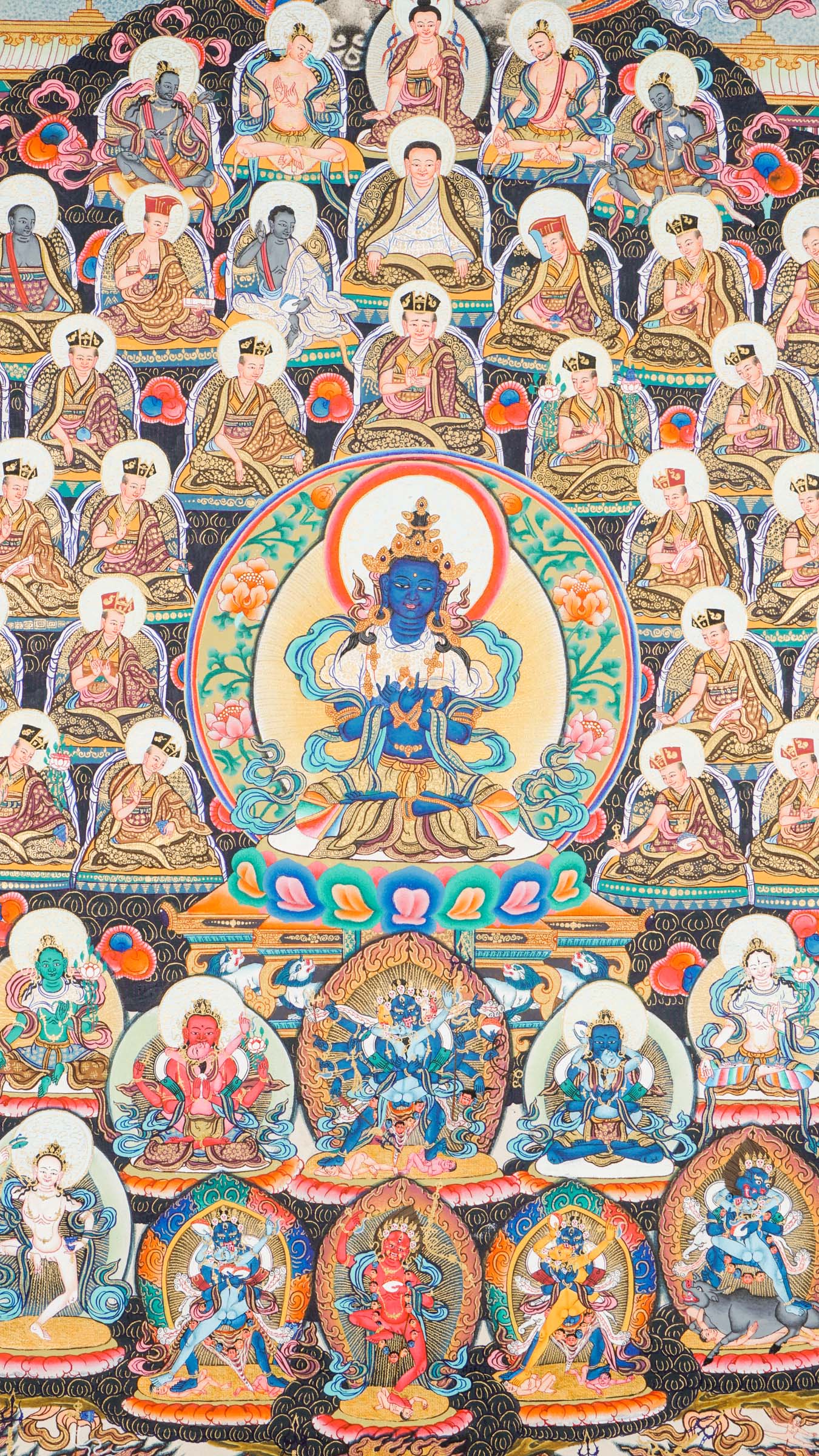 Large traditional Tibetan thangka depicting a detailed Buddhist cosmological assembly, with Vajradhara at the center surrounded by numerous Buddhas, bodhisattvas, lineage masters, and symbolic figures arranged in a complex, symmetrical composition.