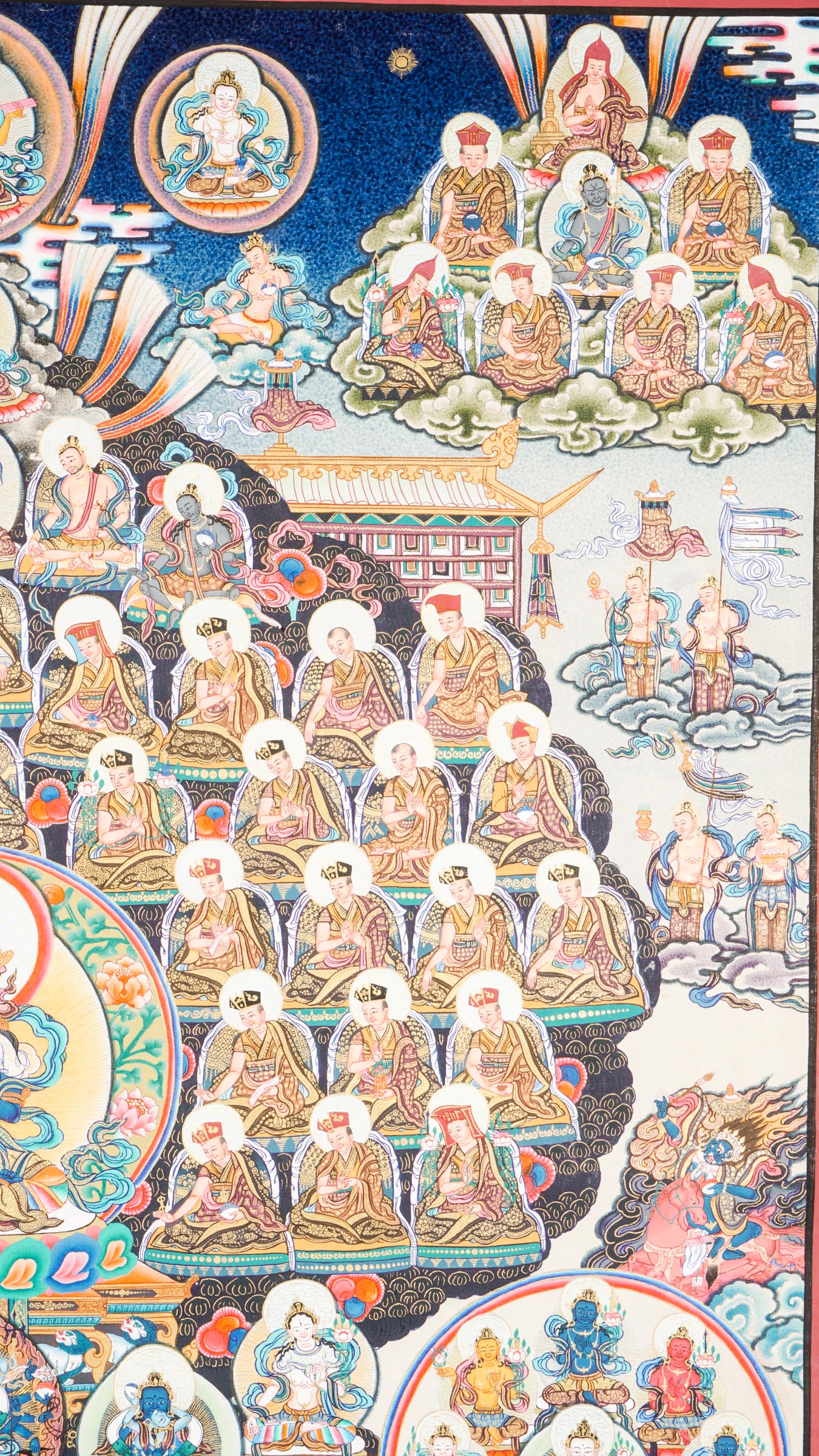 Large traditional Tibetan thangka depicting a detailed Buddhist cosmological assembly, with Vajradhara at the center surrounded by numerous Buddhas, bodhisattvas, lineage masters, and symbolic figures arranged in a complex, symmetrical composition.