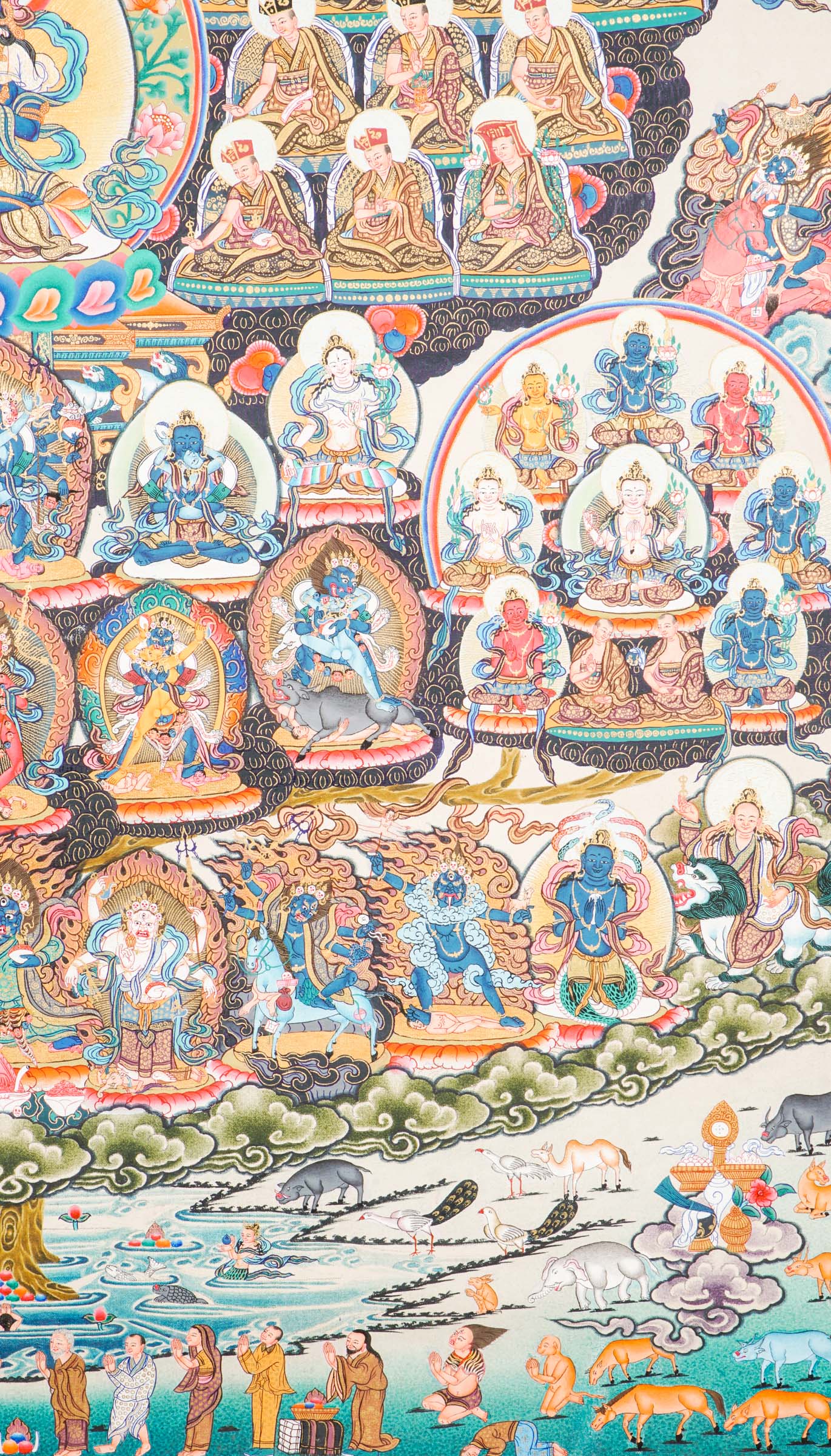 Large traditional Tibetan thangka depicting a detailed Buddhist cosmological assembly, with Vajradhara at the center surrounded by numerous Buddhas, bodhisattvas, lineage masters, and symbolic figures arranged in a complex, symmetrical composition.