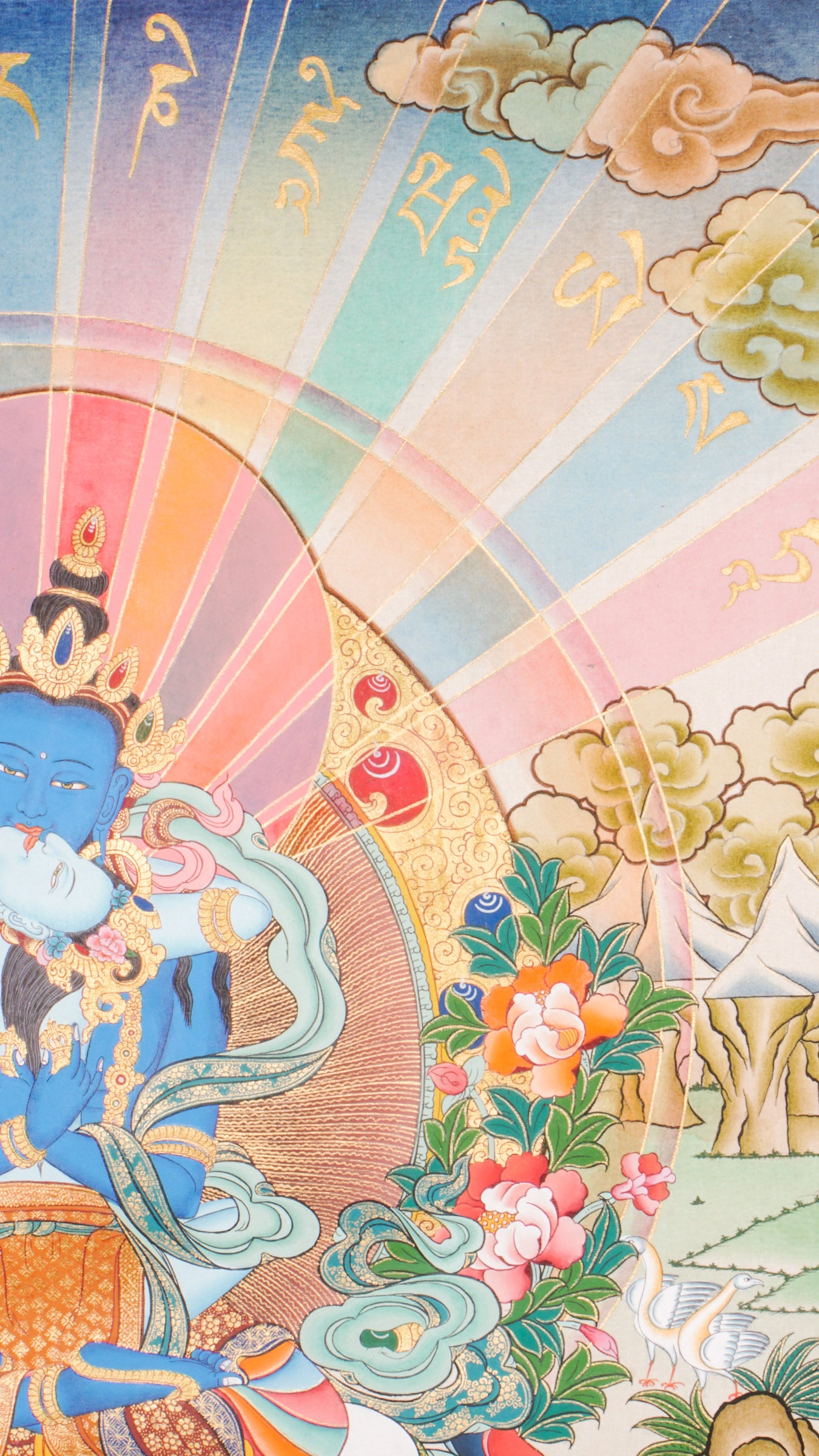 Traditional Tibetan thangka painting depicting Vajradhara Shakti in union, shown as a blue deity seated on a lotus throne with a consort, surrounded by radiant rays, clouds, floral motifs, and a symbolic landscape.