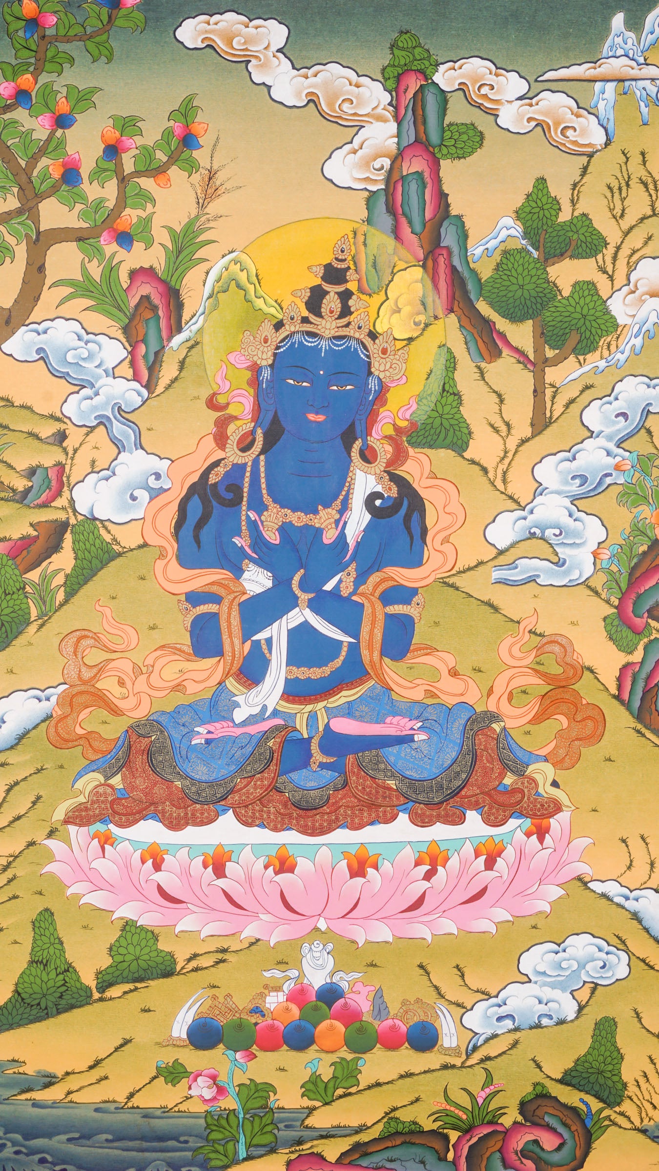 Traditional Tibetan thangka painting depicting Vajradhara, a blue-skinned primordial Buddha seated in meditation on a lotus throne, holding ritual symbols, with clouds, mountains, and a serene natural landscape in the background.