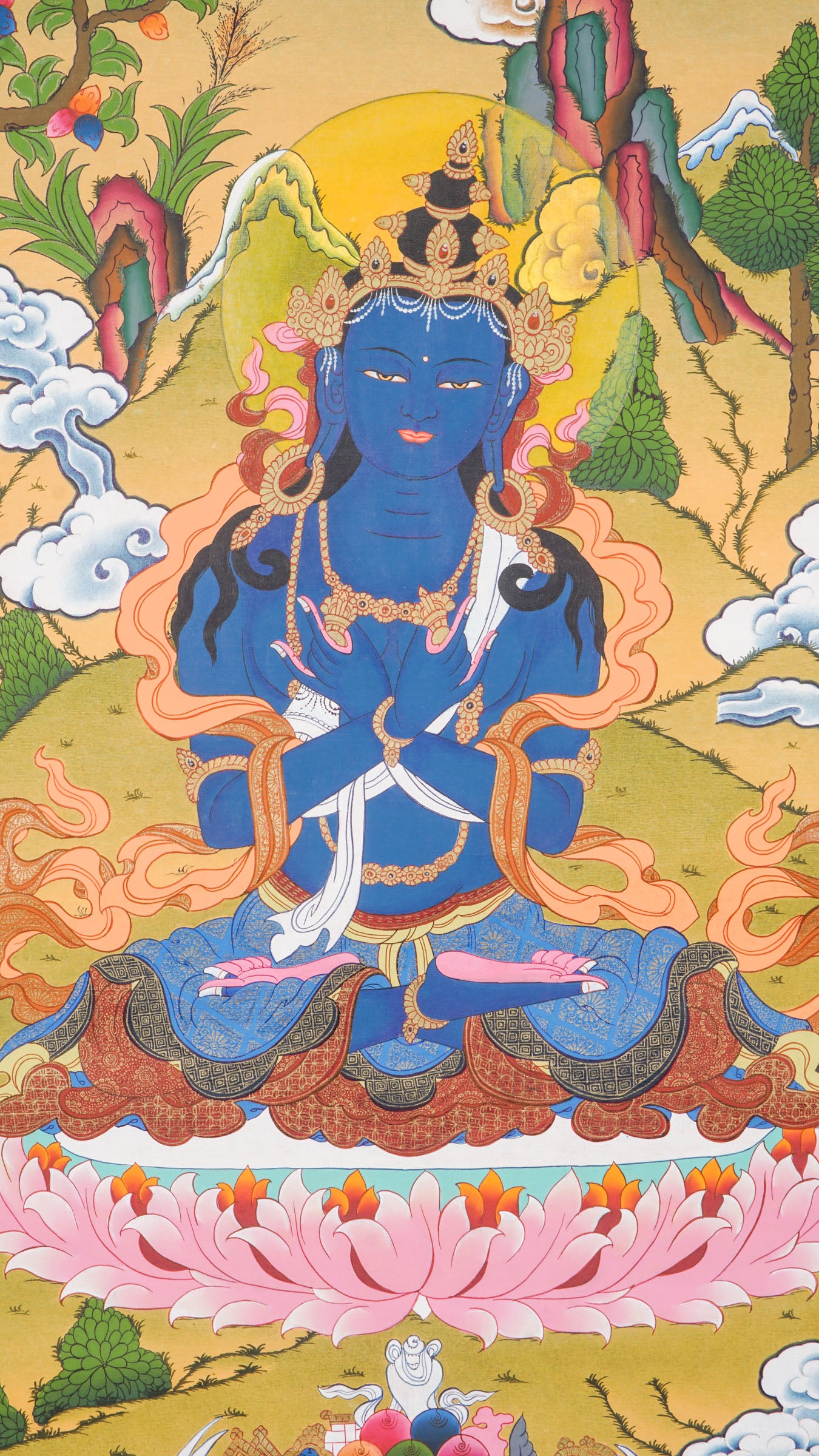 Traditional Tibetan thangka painting depicting Vajradhara, a blue-skinned primordial Buddha seated in meditation on a lotus throne, holding ritual symbols, with clouds, mountains, and a serene natural landscape in the background.