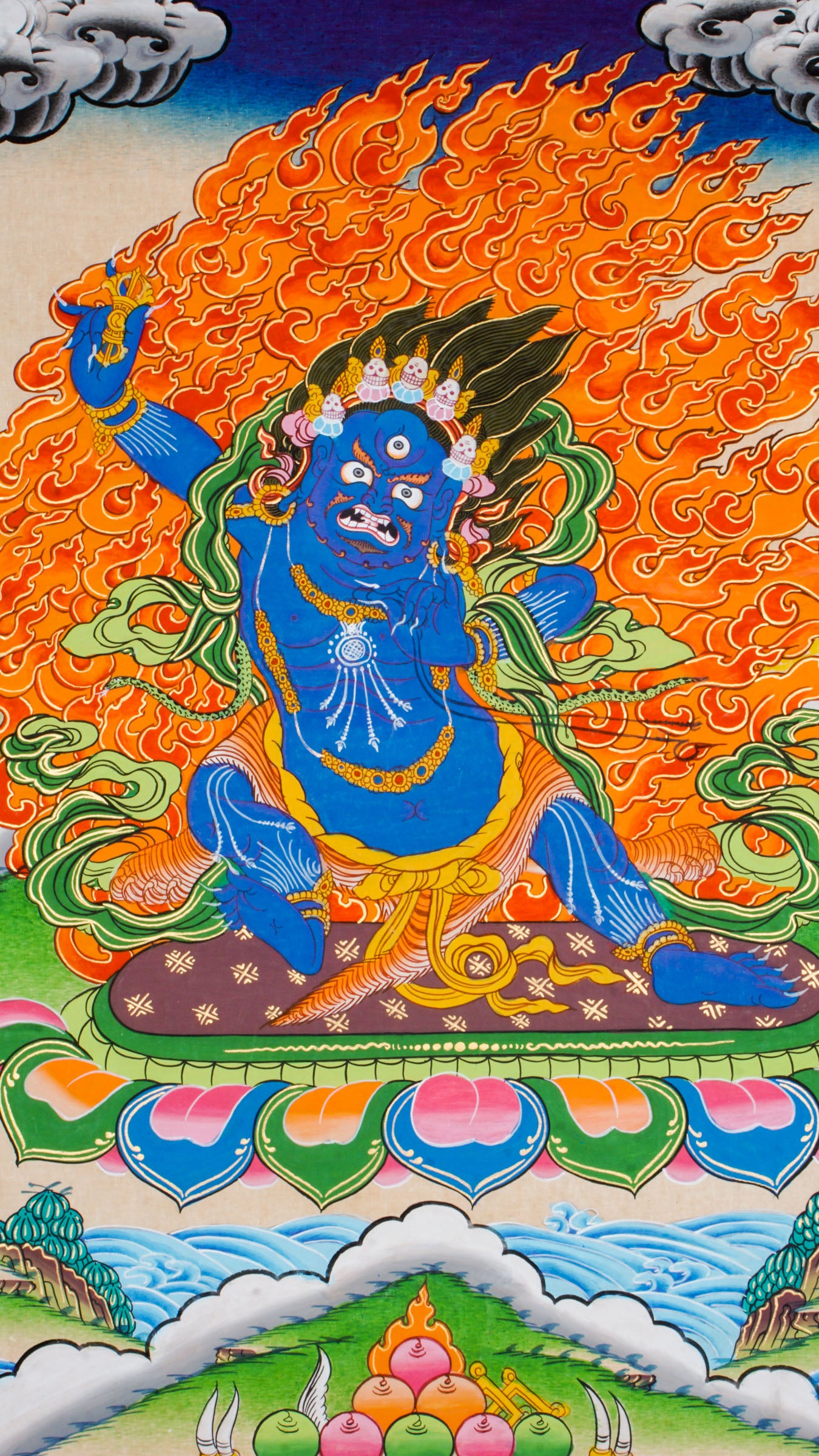 Traditional Tibetan thangka painting depicting Vajrapani, a blue-skinned wrathful deity in a powerful stance on a lotus throne, encircled by flames, with clouds and mountains in the background.