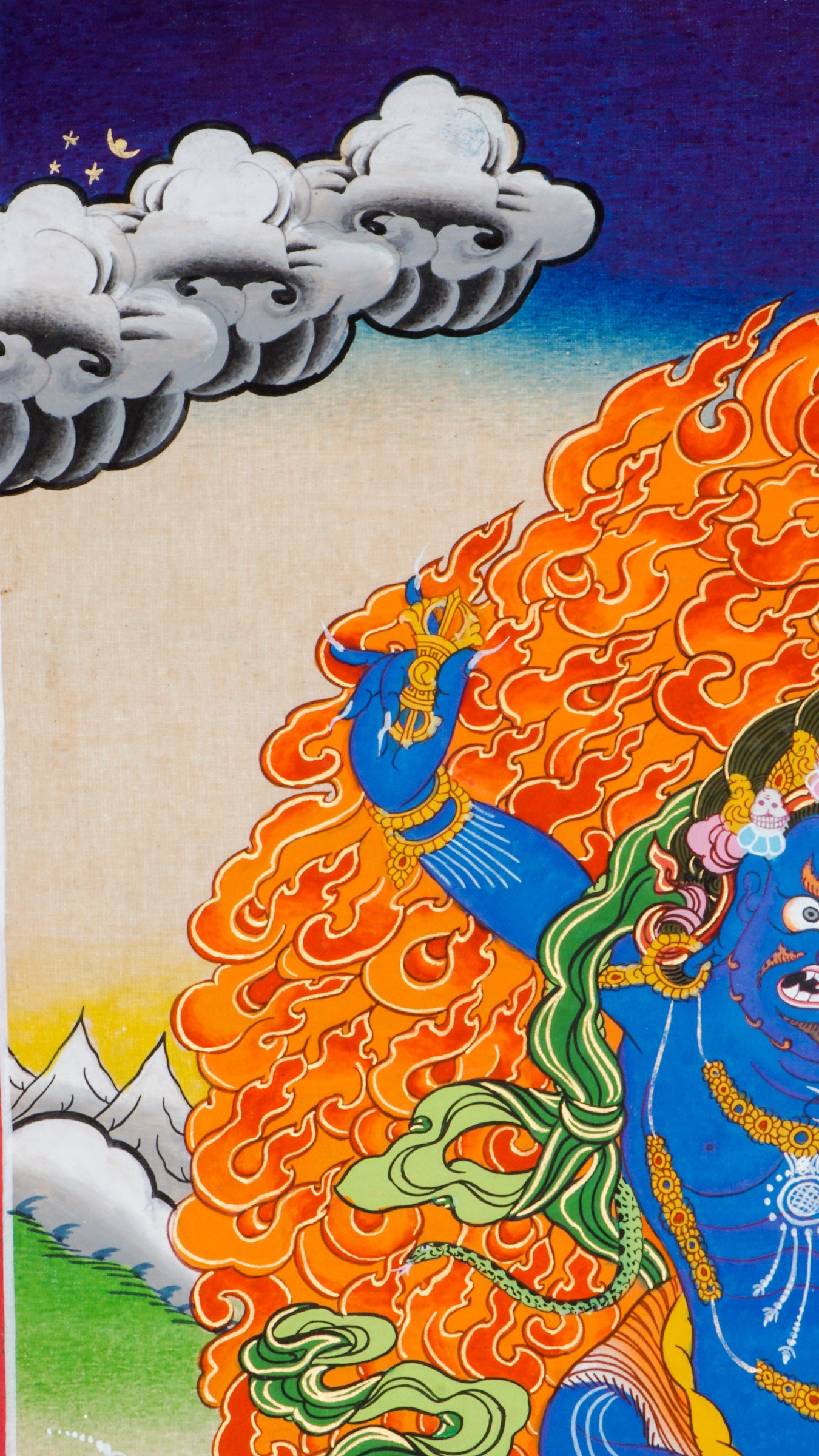 Traditional Tibetan thangka painting depicting Vajrapani, a blue-skinned wrathful deity in a powerful stance on a lotus throne, encircled by flames, with clouds and mountains in the background.