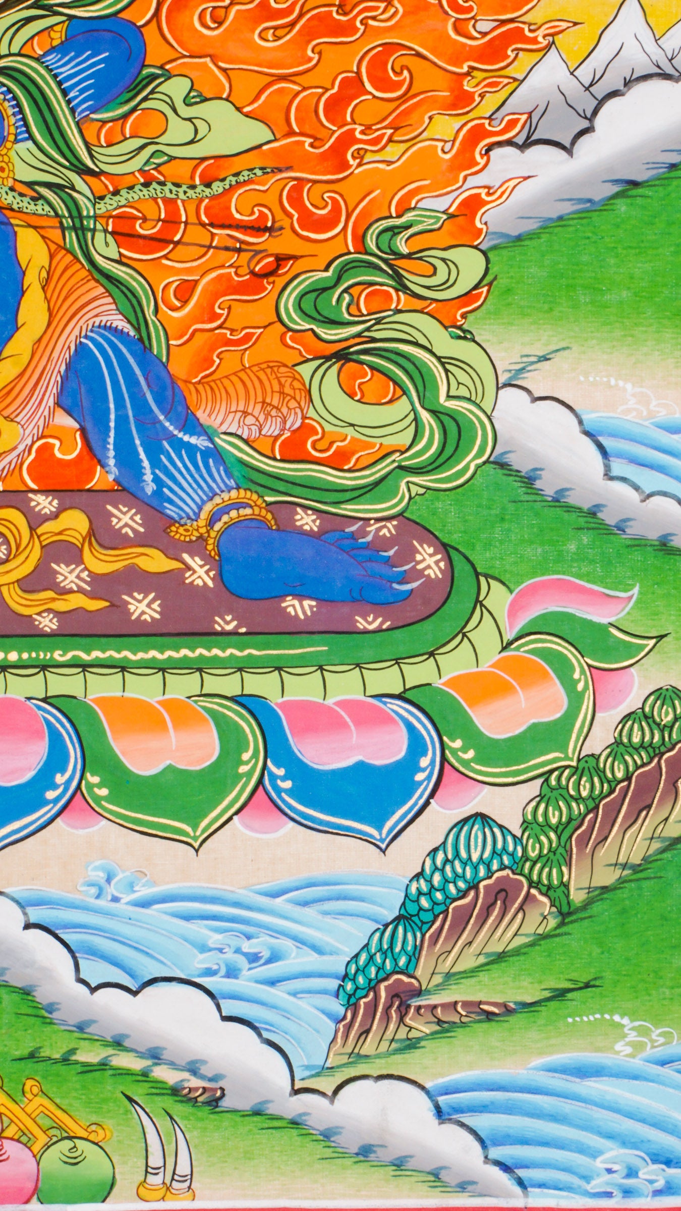Traditional Tibetan thangka painting depicting Vajrapani, a blue-skinned wrathful deity in a powerful stance on a lotus throne, encircled by flames, with clouds and mountains in the background.