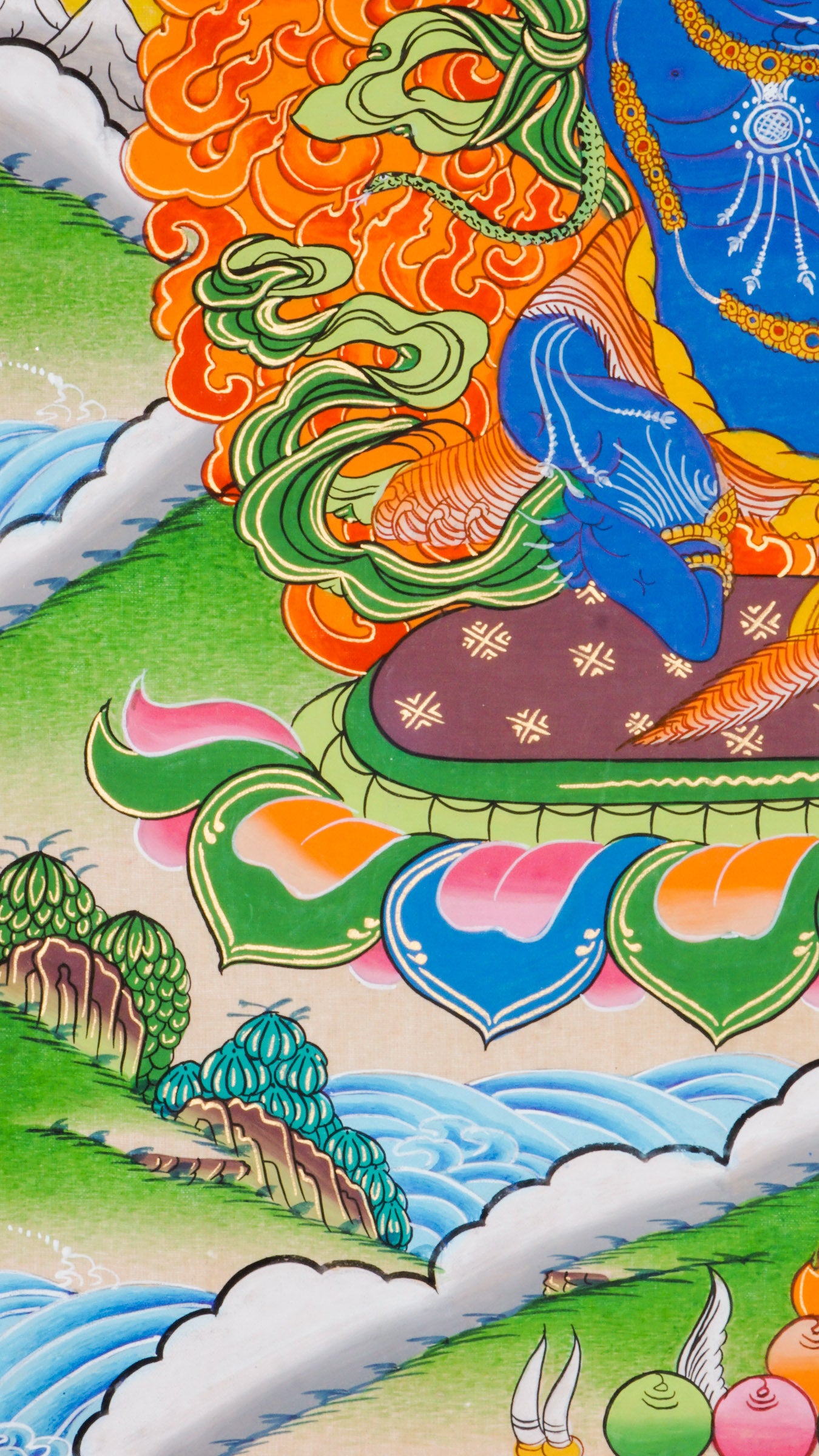Traditional Tibetan thangka painting depicting Vajrapani, a blue-skinned wrathful deity in a powerful stance on a lotus throne, encircled by flames, with clouds and mountains in the background.