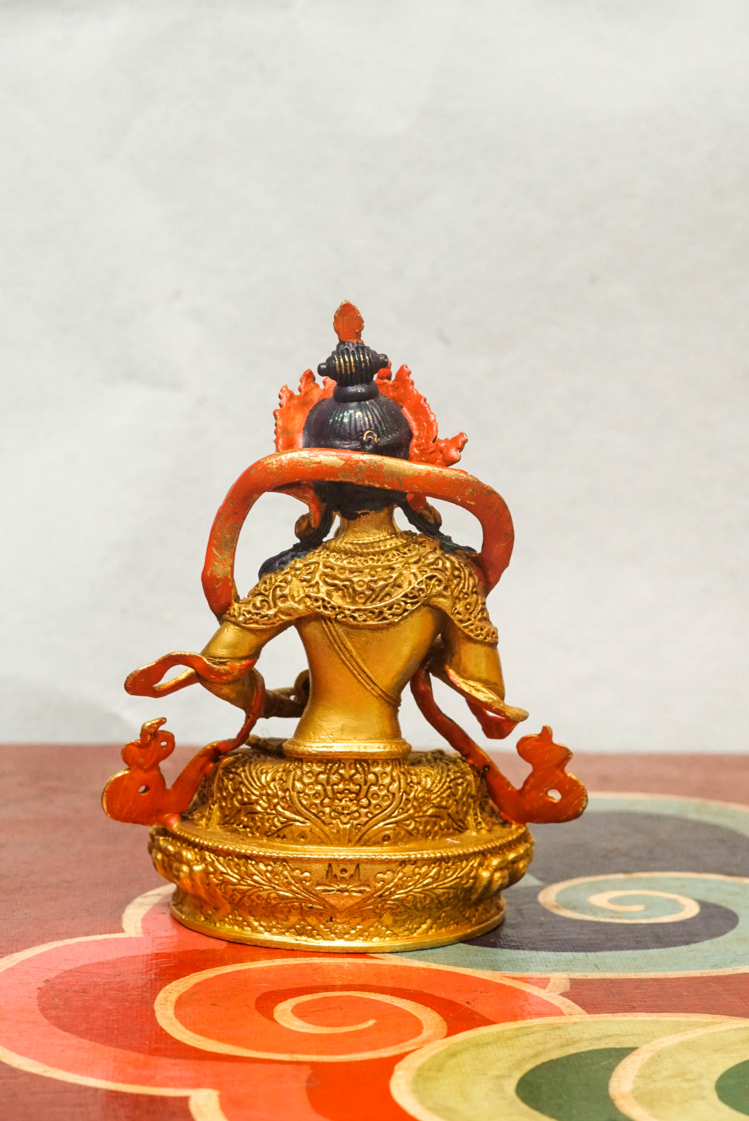 Handcrafted Vajrasattva statue seated in lotus posture, holding a vajra and bell, symbolizing spiritual purity, compassion, and wisdom in Vajrayana Buddhism.
