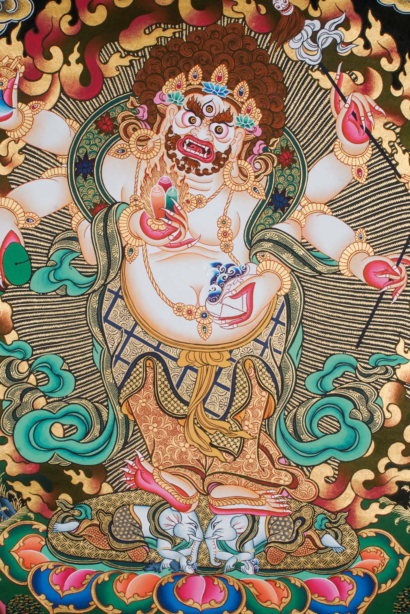 A sacred hand-painted art with 24k gold and natural pigments of a fierce protector form of the Buddha of compassion.