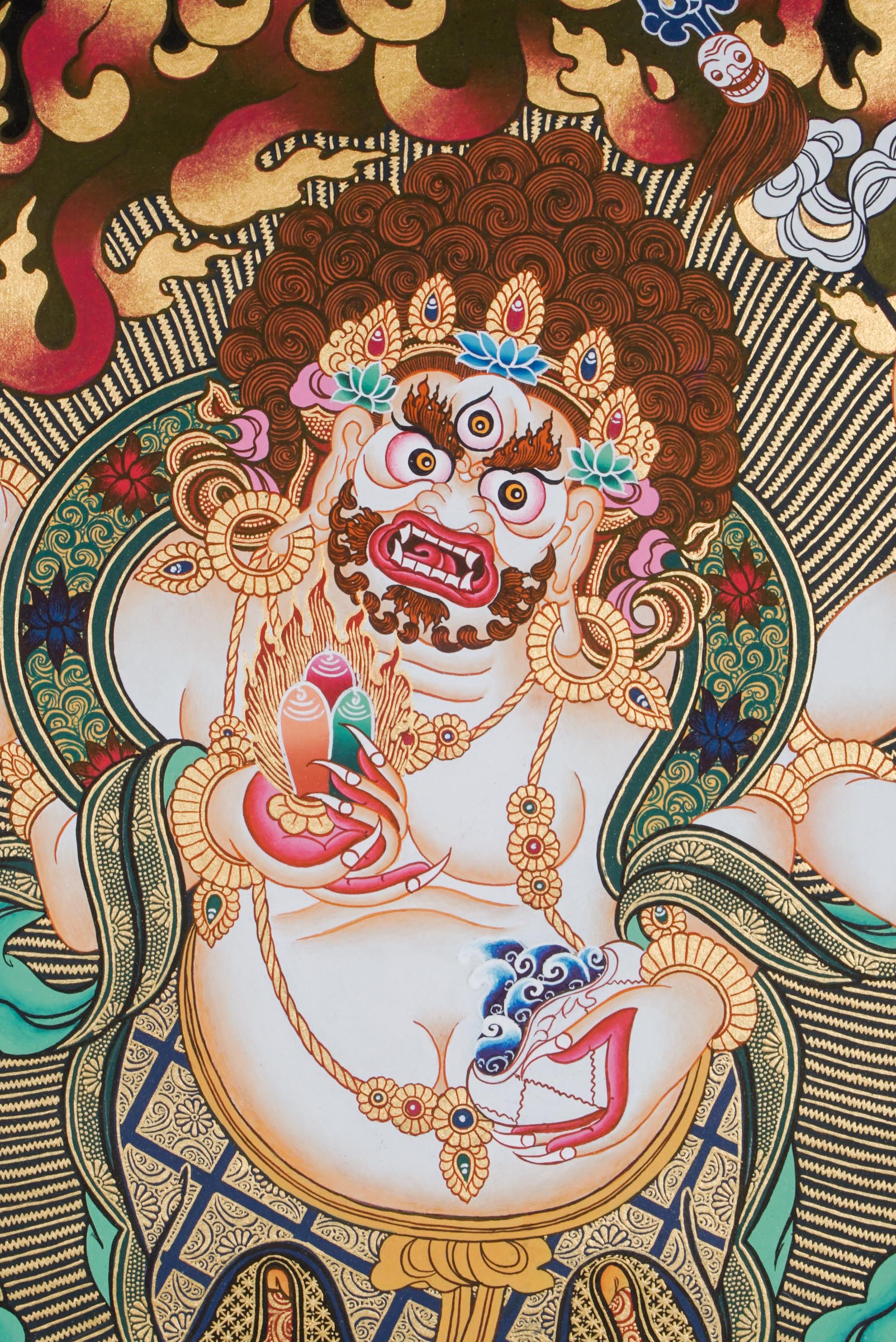 A sacred hand-painted art with 24k gold and natural pigments of a fierce protector form of the Buddha of compassion.