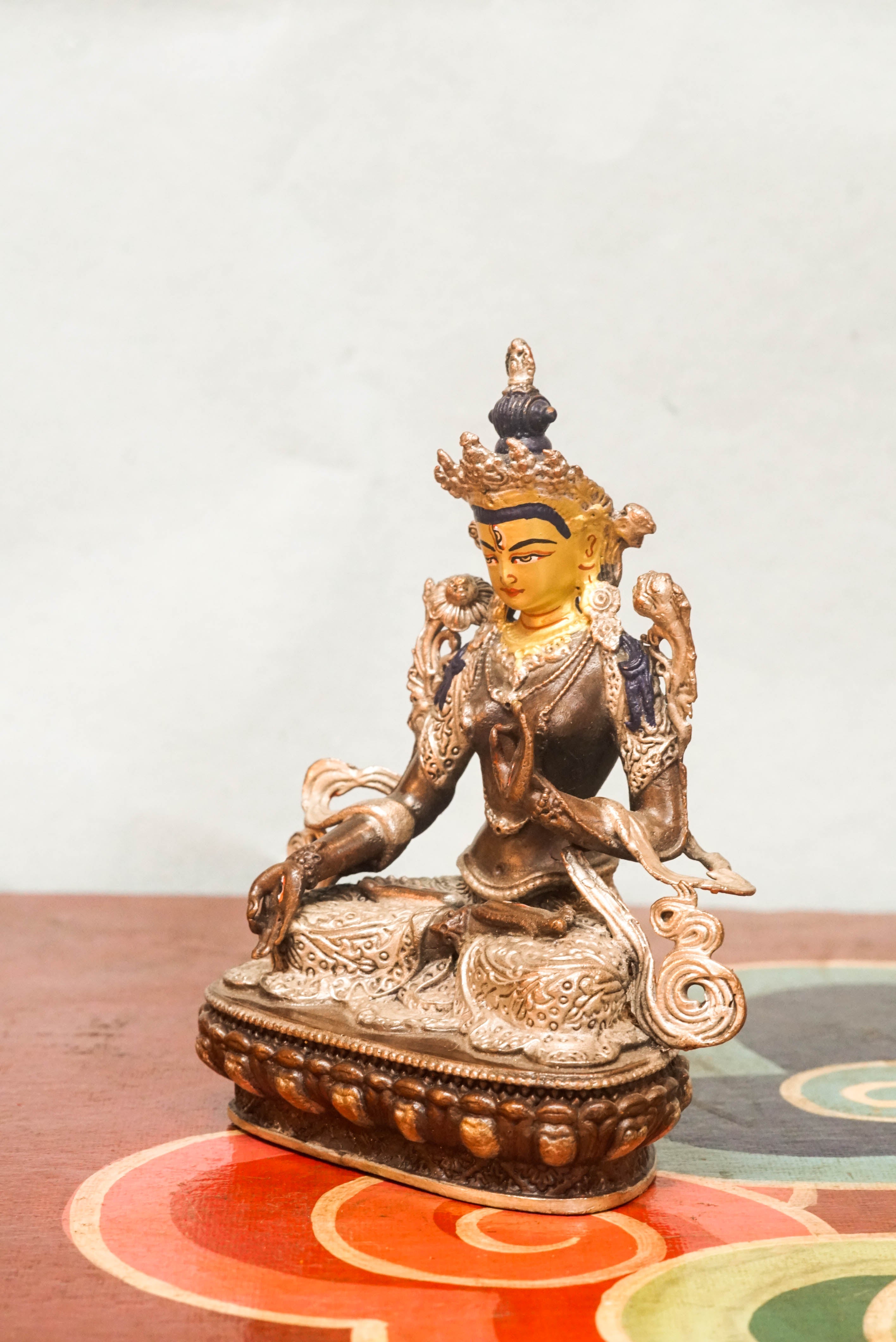 Handmade silver White Tara statue, depicting the compassionate goddess with calm expression and symbolic seven eyes.