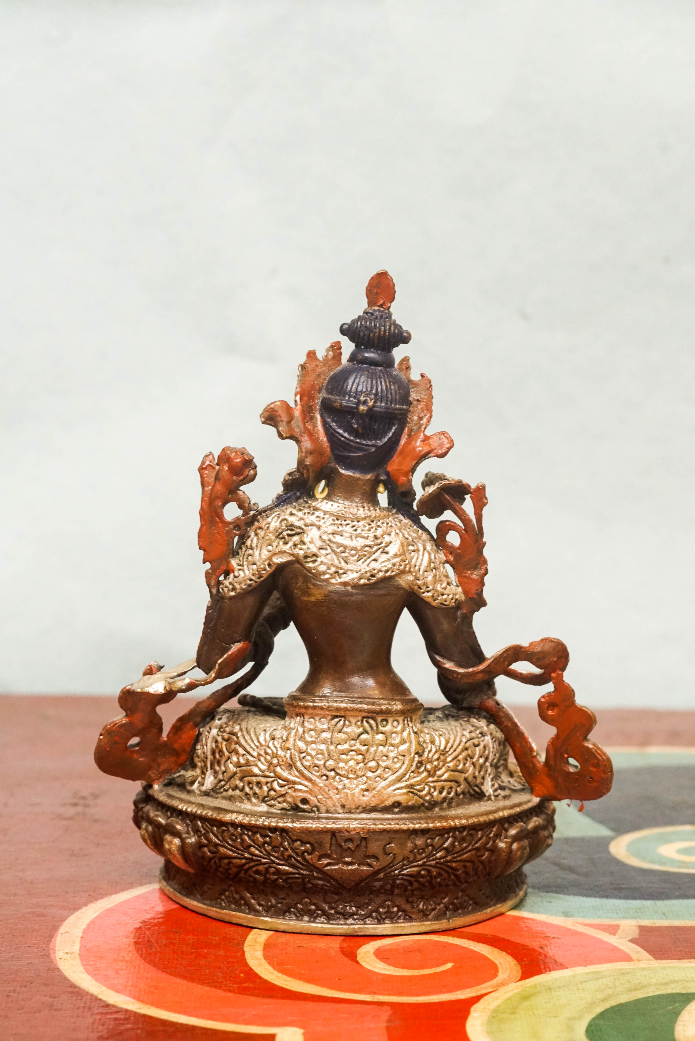 Handmade silver White Tara statue, depicting the compassionate goddess with calm expression and symbolic seven eyes.