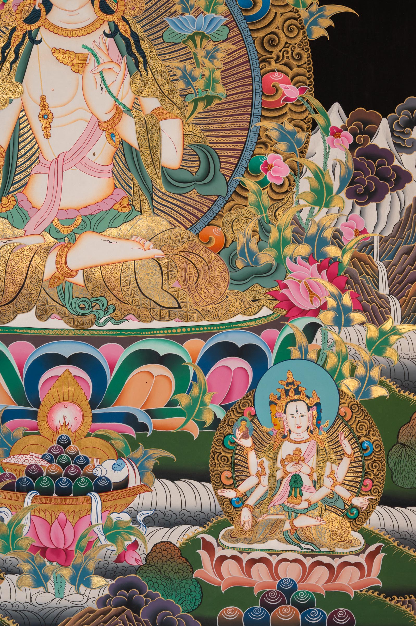 White Tara Thangka - a colorful depiction of a central figure with ornate surroundings