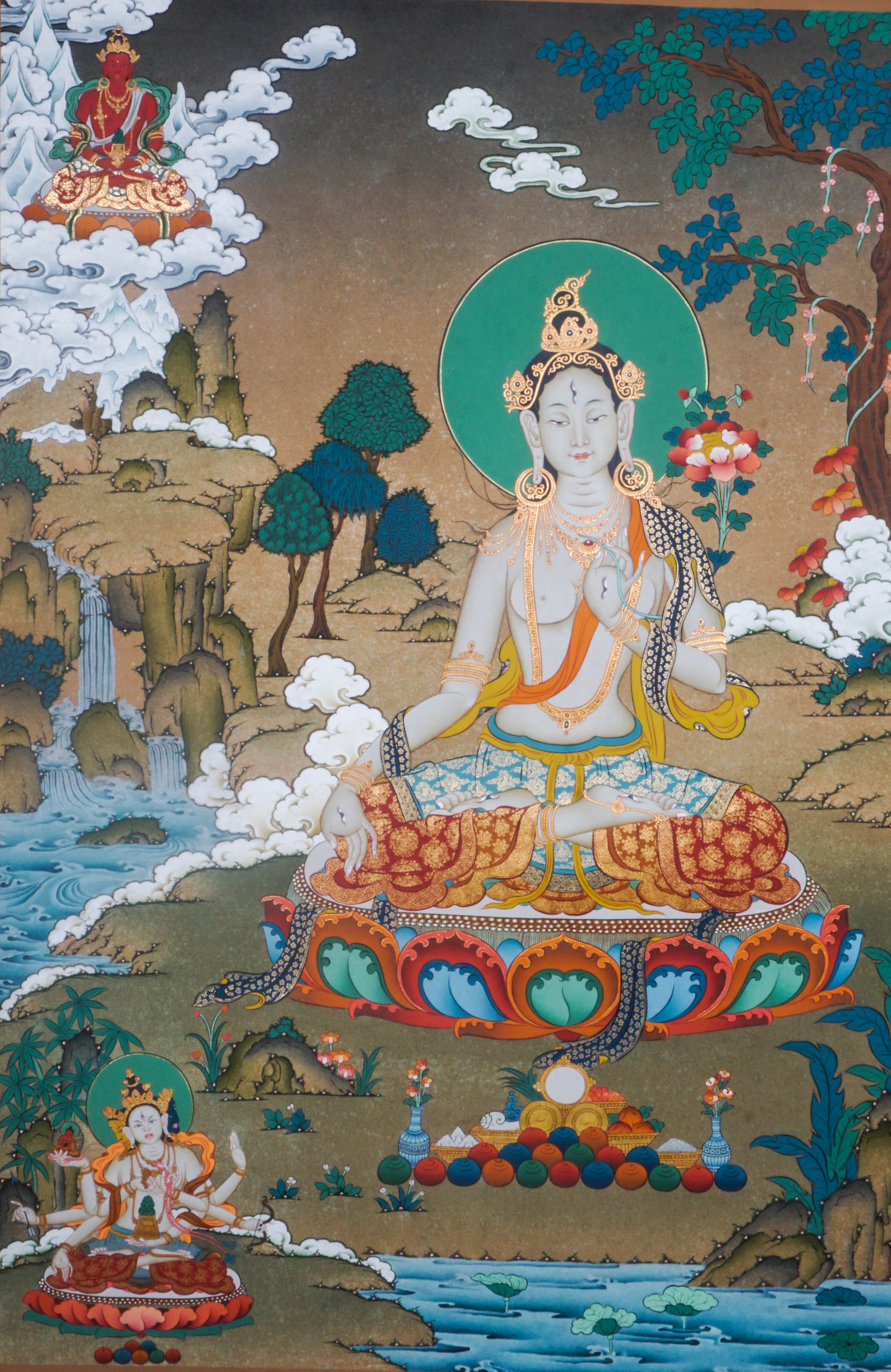 Hand-painted White Tara thangka artwork featuring traditional Tibetan Buddhist iconography, lotus base, scenic landscape, and intricate detailing.