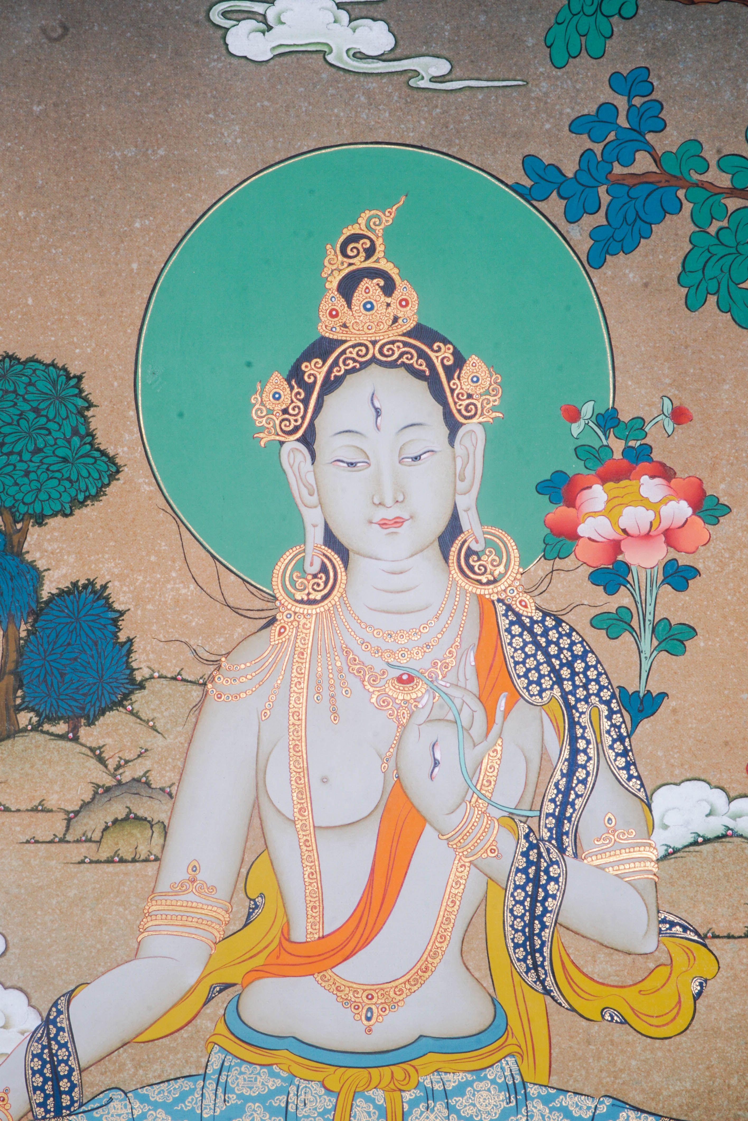 Hand-painted White Tara thangka artwork featuring traditional Tibetan Buddhist iconography, lotus base, scenic landscape, and intricate detailing.