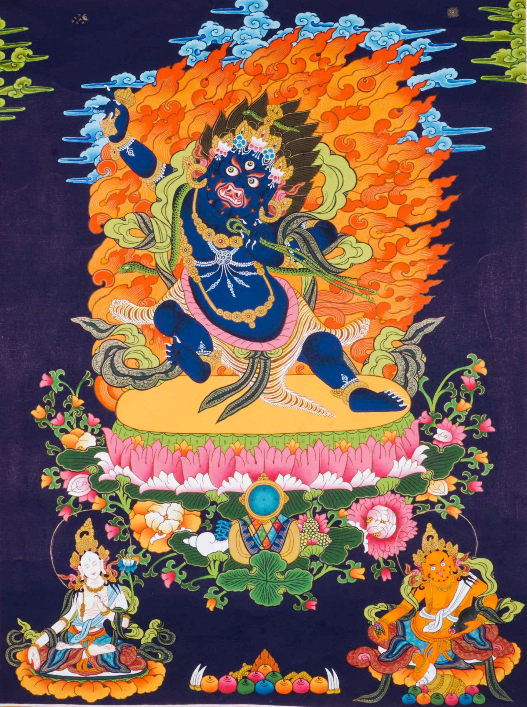 Traditional Tibetan thangka painting depicting wrathful Vajrapani, a blue-skinned deity in a powerful dynamic pose on a lotus throne, surrounded by blazing flames, clouds, and ornate symbolic details against a deep blue background.