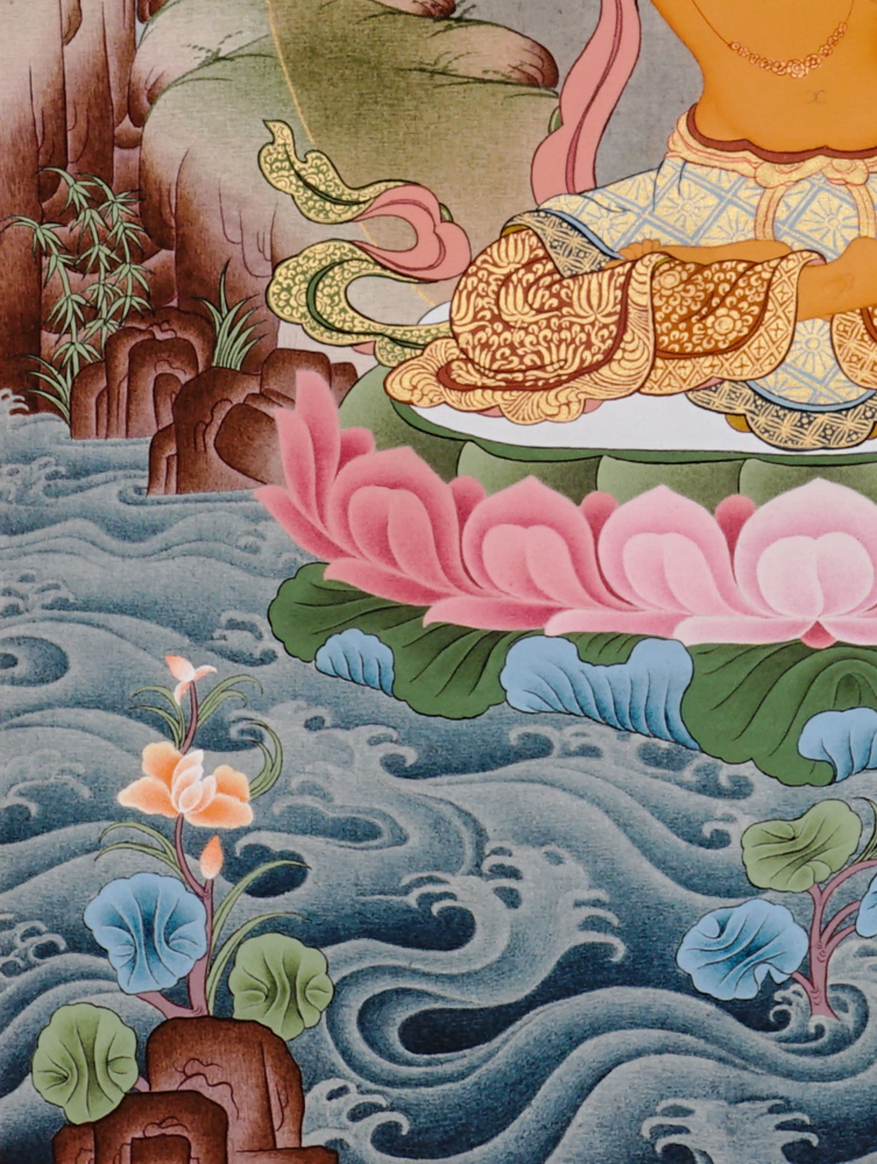 Manjushree Bodhisattva seated on a pink lotus above flowing water, holding flaming wisdom sword and sacred scripture lotus.