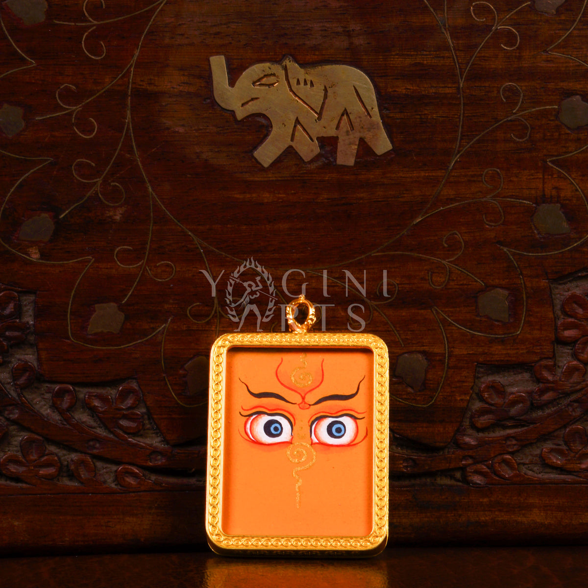 Hand-painted Zambhala Eyes Ghau pendant with sacred Buddha Wisdom Eyes in a handcrafted gold-tone frame made in Nepal.