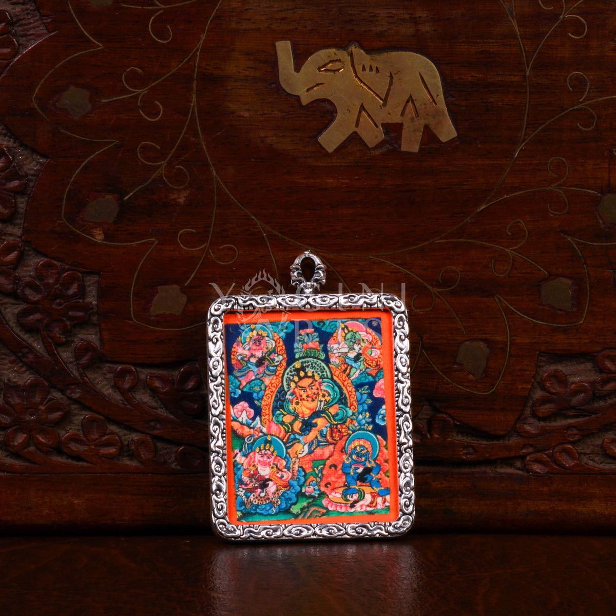 Hand-painted Five Zambhala Ghau pendant featuring the Five Buddhist Wealth Deities in a handcrafted silver-tone frame made in Nepal.