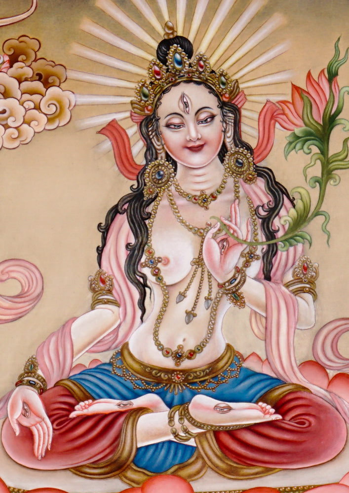 Hand-painted Newari White Tara thangka showing the Buddhist goddess of compassion seated on a lotus throne holding a utpala flower.