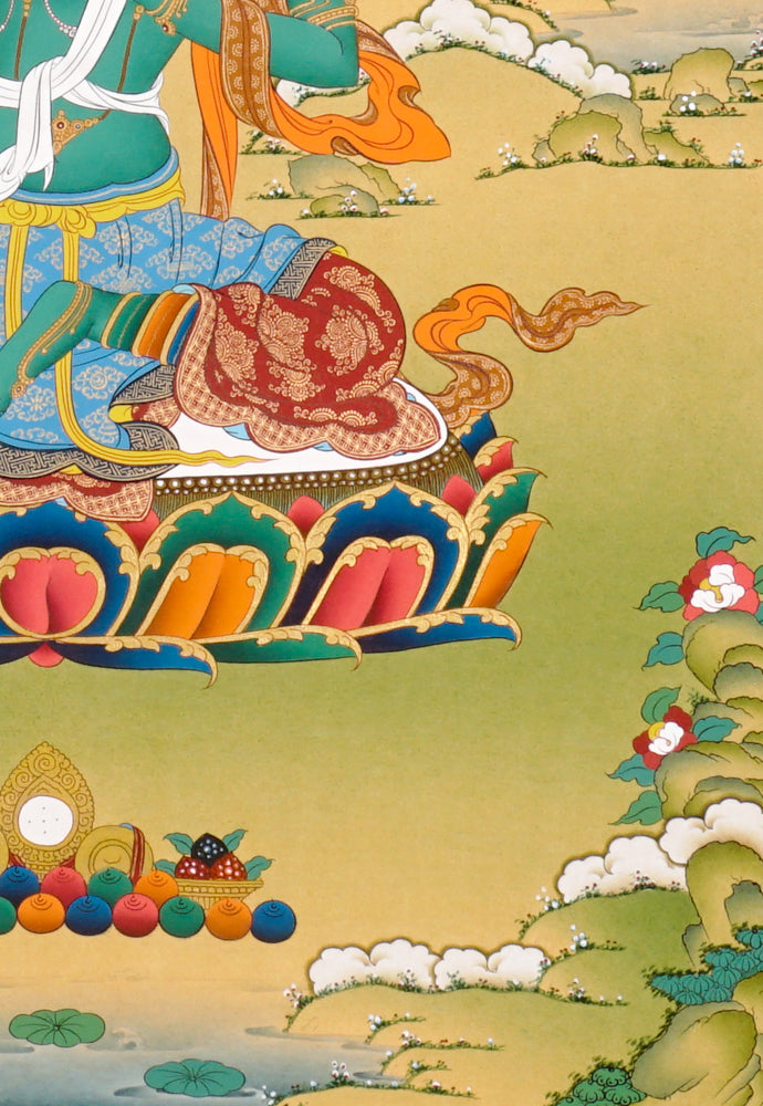 Hand-painted Green Tara thangka showing the Buddhist goddess seated on a lotus throne holding a blue utpala flower.