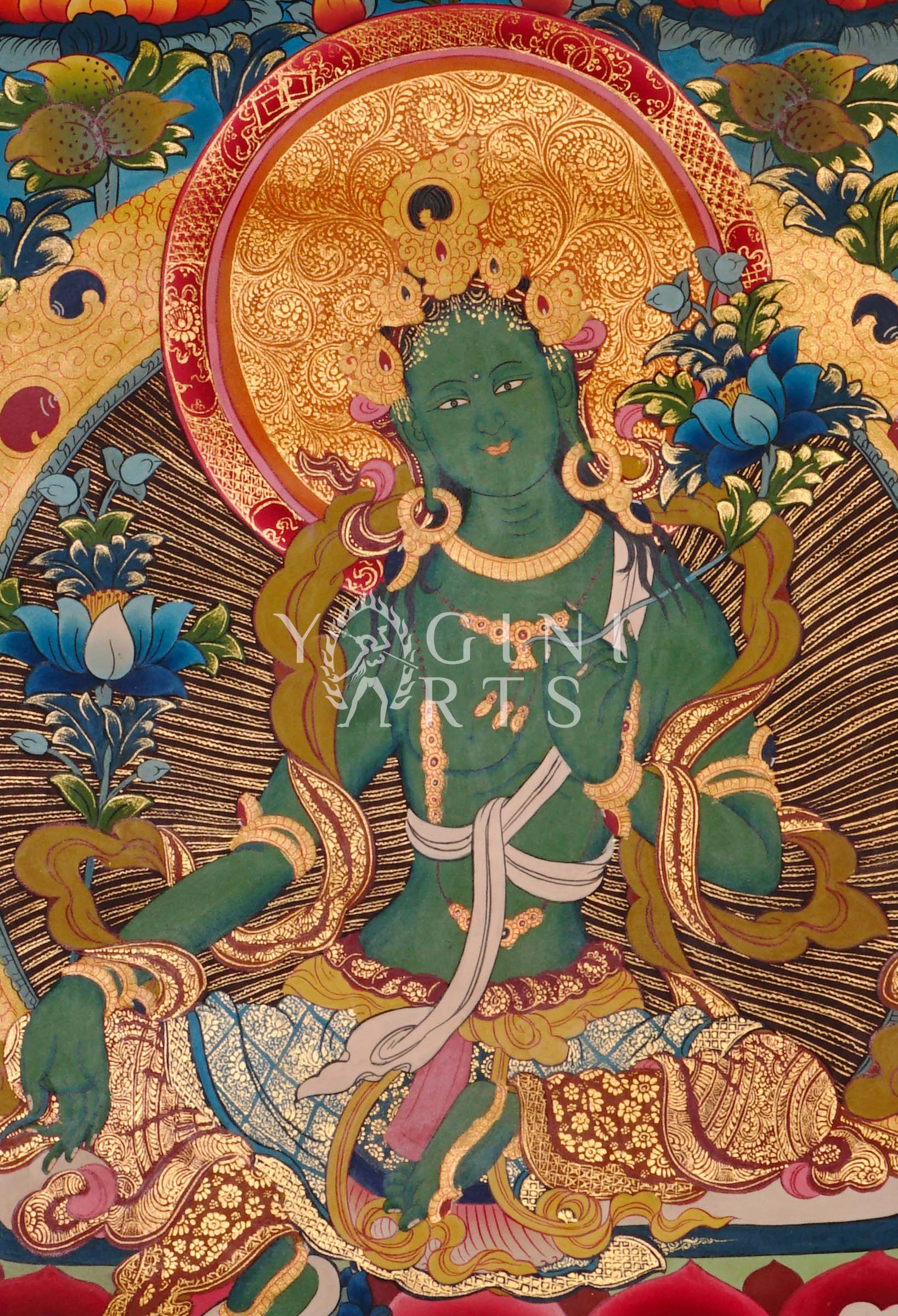 Green Tara thangka featuring the Buddhist goddess of compassion seated on a lotus throne surrounded by vibrant sacred symbolism and gold detailing