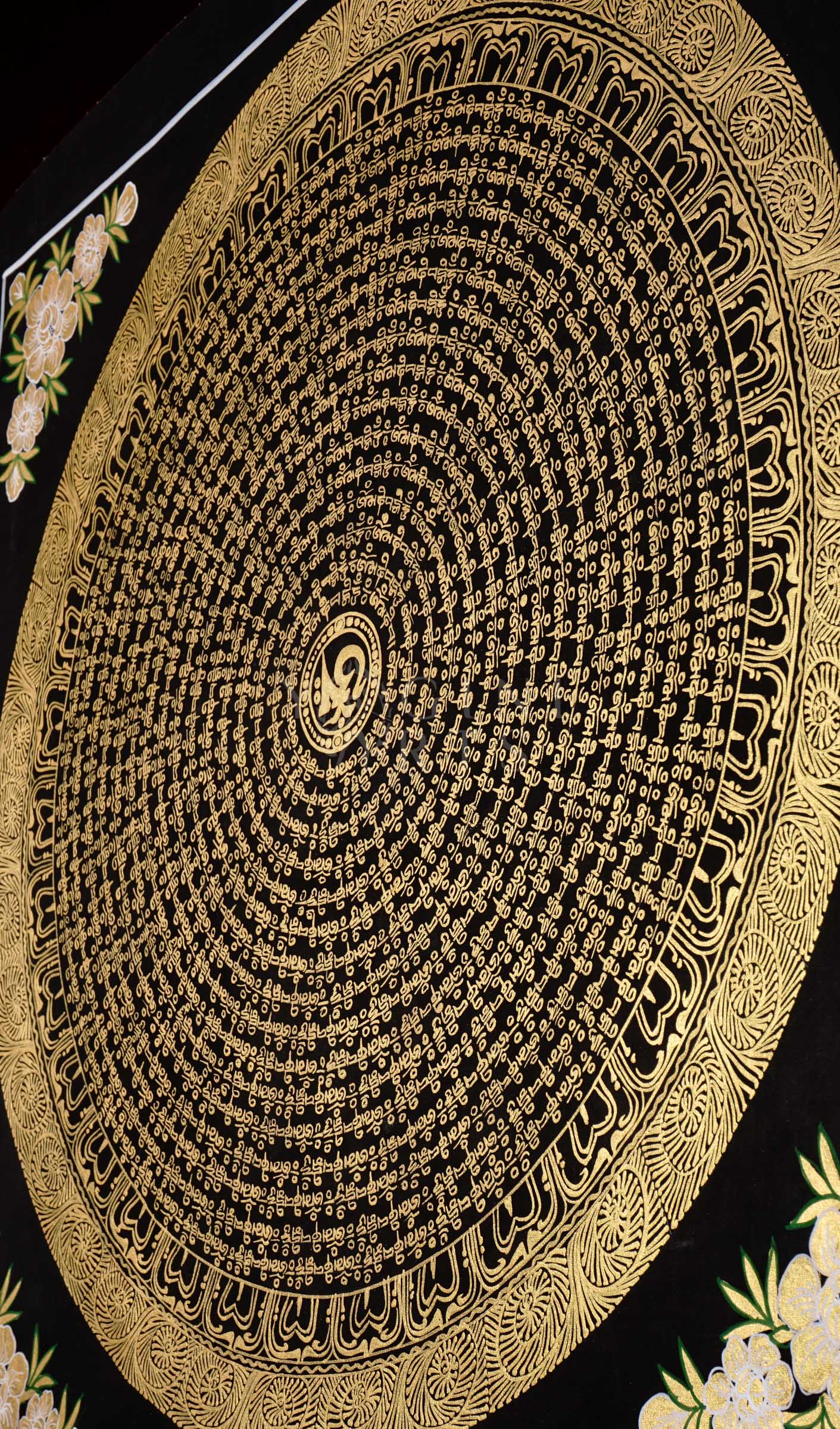 Hand-painted Tibetan Golden Mantra Mandala thangka featuring intricate sacred Tibetan calligraphy in concentric circular patterns on a black background with floral corner motifs.