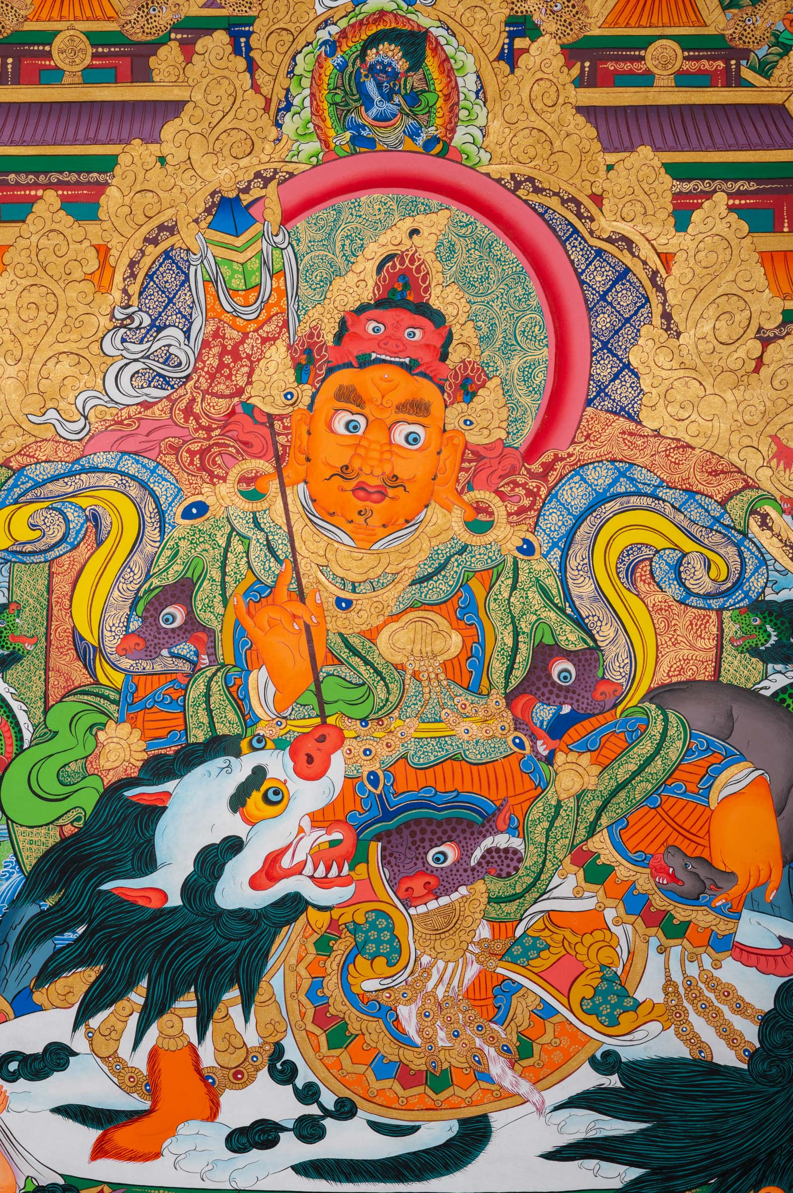 Tibetan Buddhist thangka painting of Zambala (Dzambhala), the deity of wealth and prosperity, depicted in royal posture holding a jewel-spouting mongoose and a treasure vase, seated amid a richly detailed paradise landscape with palatial architecture, snow mountains, flowing rivers, and numerous attendant deities and guardians, finely hand-painted in traditional Tibetan style using vibrant mineral pigments.