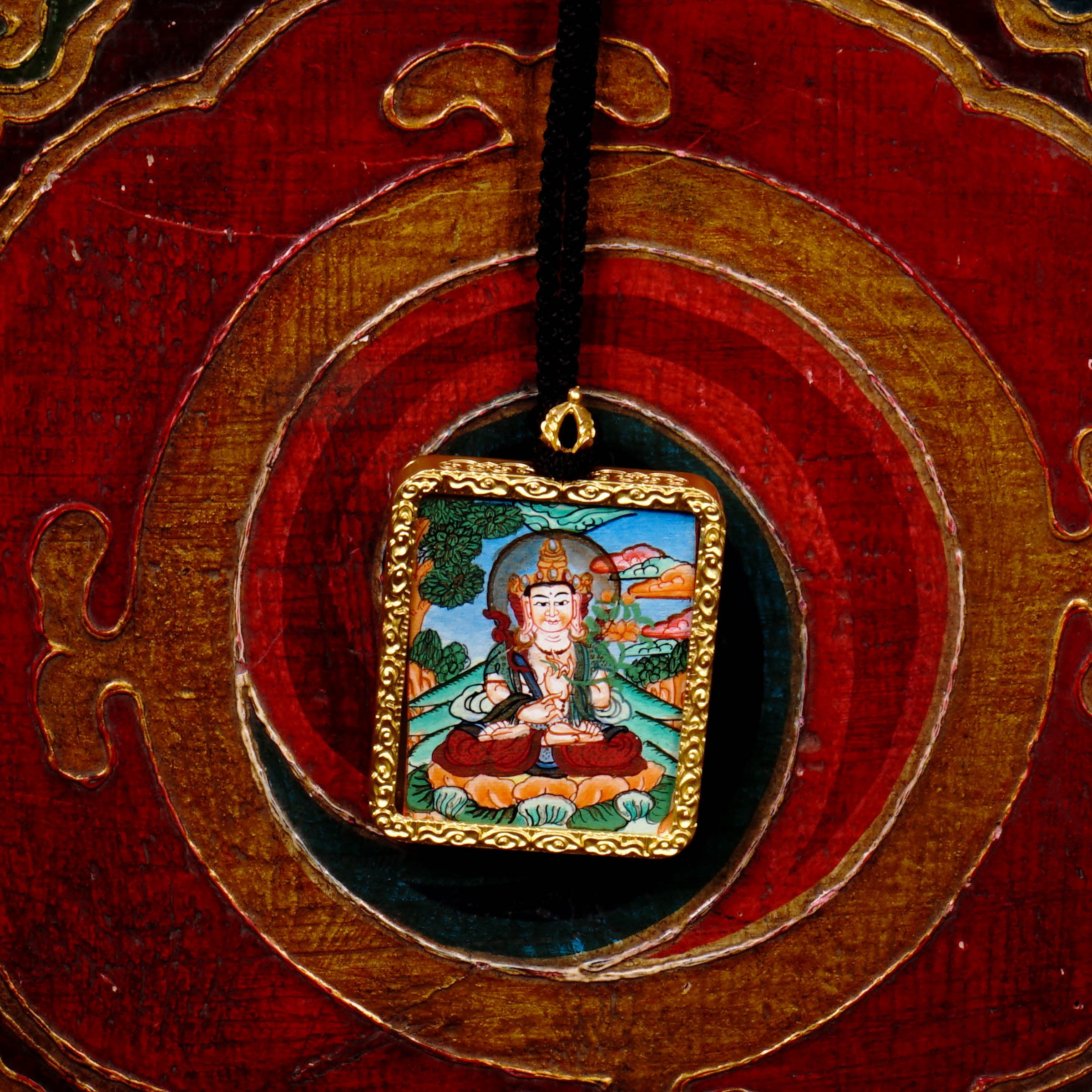 Hand-painted Fushen Fusa Bodhisattva miniature Thangka pendant in gold-accented copper Ghau locket with black beaded cord.