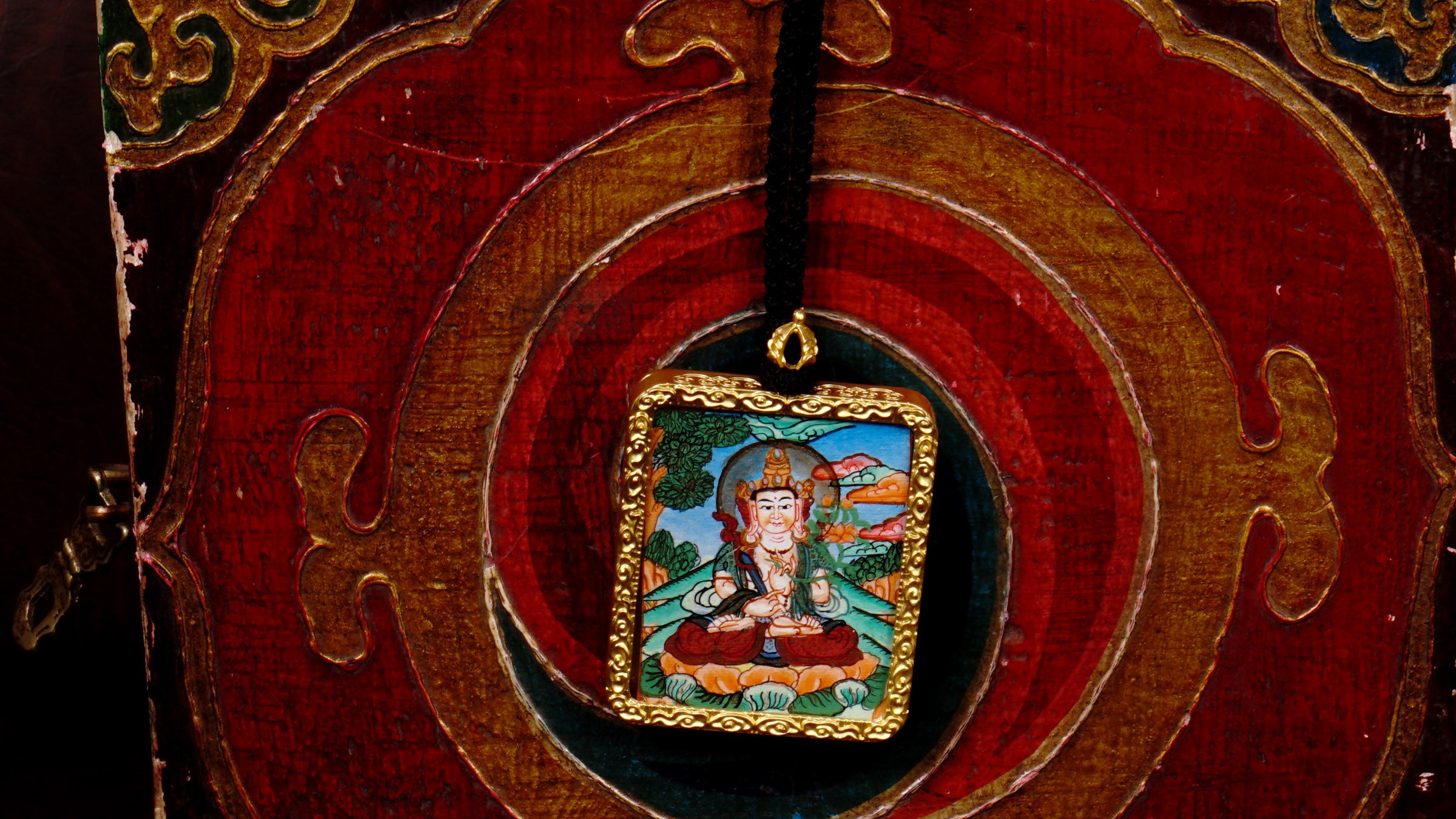 Hand-painted Fushen Fusa Bodhisattva miniature Thangka pendant in gold-accented copper Ghau locket with black beaded cord.