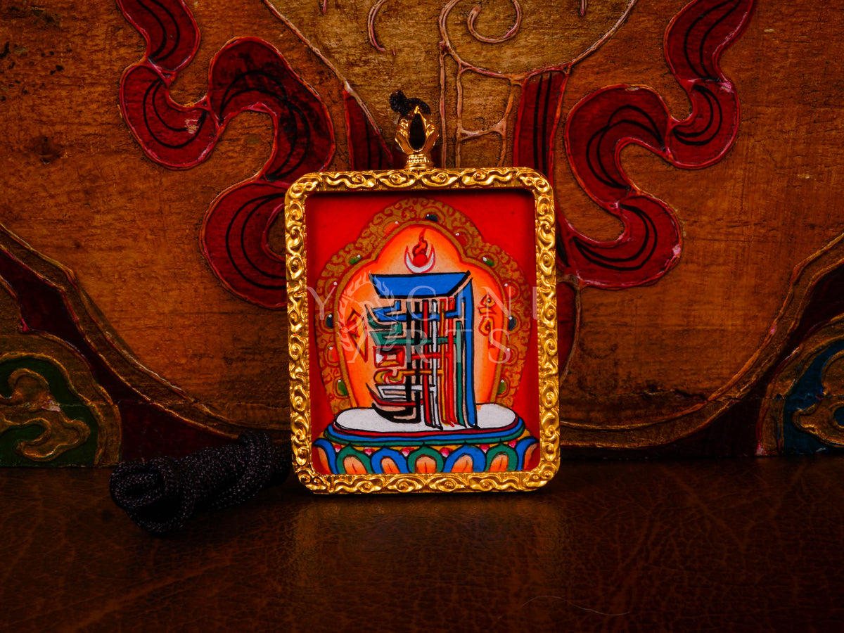 Hand-painted Kalachakra Mandala Ghau pendant in a gold-tone frame, handcrafted in Nepal using traditional Himalayan miniature painting techniques.