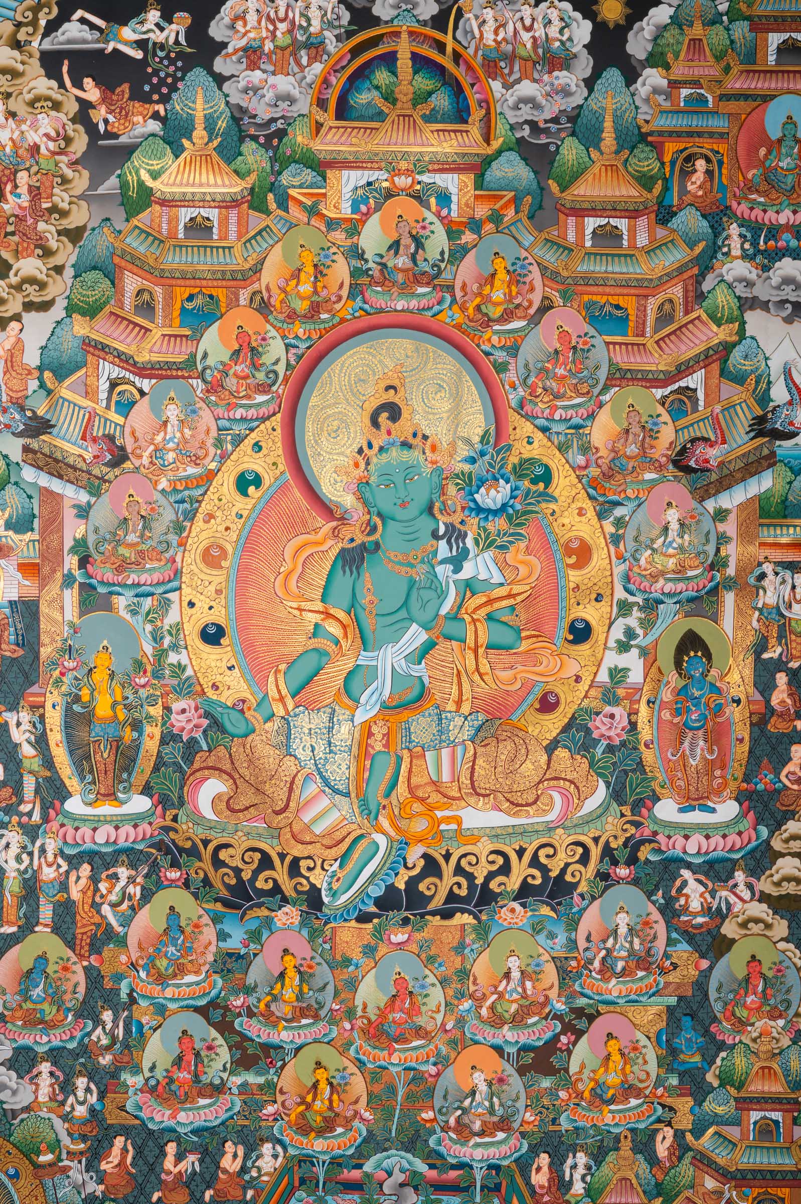Tibetan Buddhist thangka painting of Amitābha Buddha seated at the center in meditation posture holding an alms bowl, flanked by Avalokiteśvara (Chenrezig) and Green Tārā, set within the celestial Pure Land of Sukhāvatī featuring ornate palace architecture, lotus thrones, countless bodhisattvas, disciples, offering goddesses, and devotees, intricately hand-painted in traditional Tibetan style using natural mineral pigments.