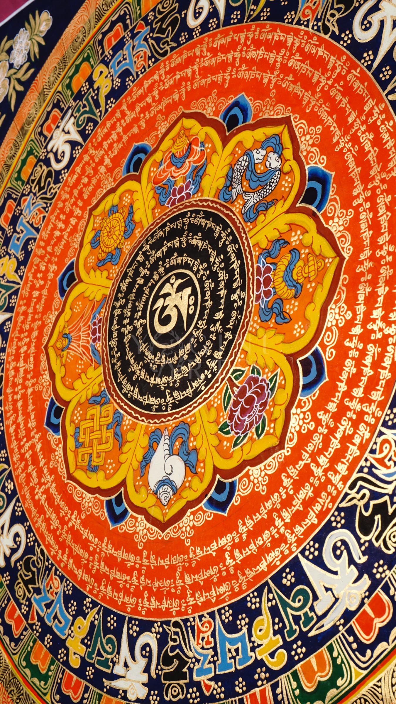 Hand-painted Tibetan Sacred Om Lotus Mantra Mandala thangka featuring central Om symbol, concentric Tibetan mantra circles, lotus petals, and vibrant Buddhist sacred geometry.