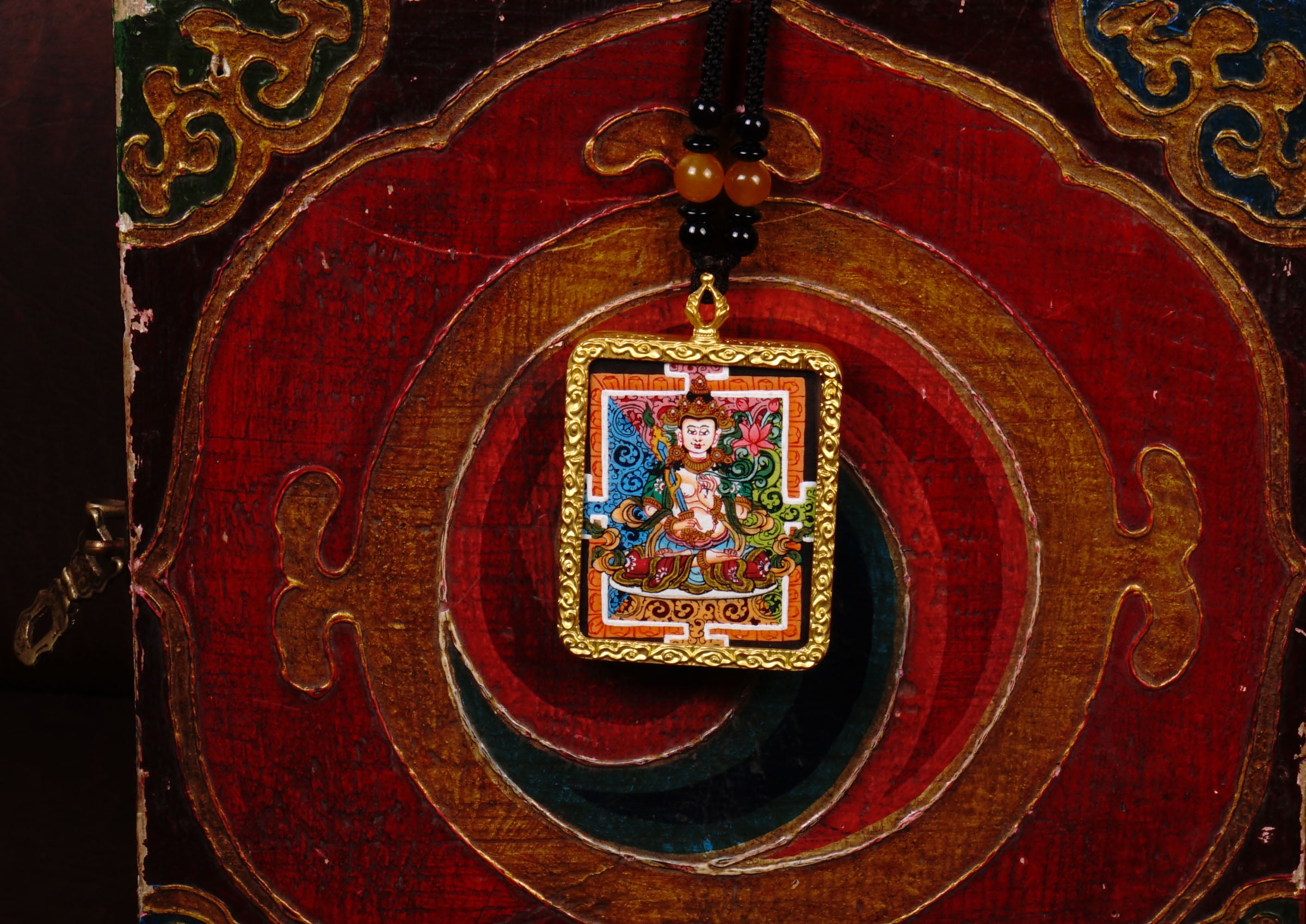 Hand-painted Fushen Fusa miniature Thangka pendant in gold-accented copper Ghau locket with black beaded cord.