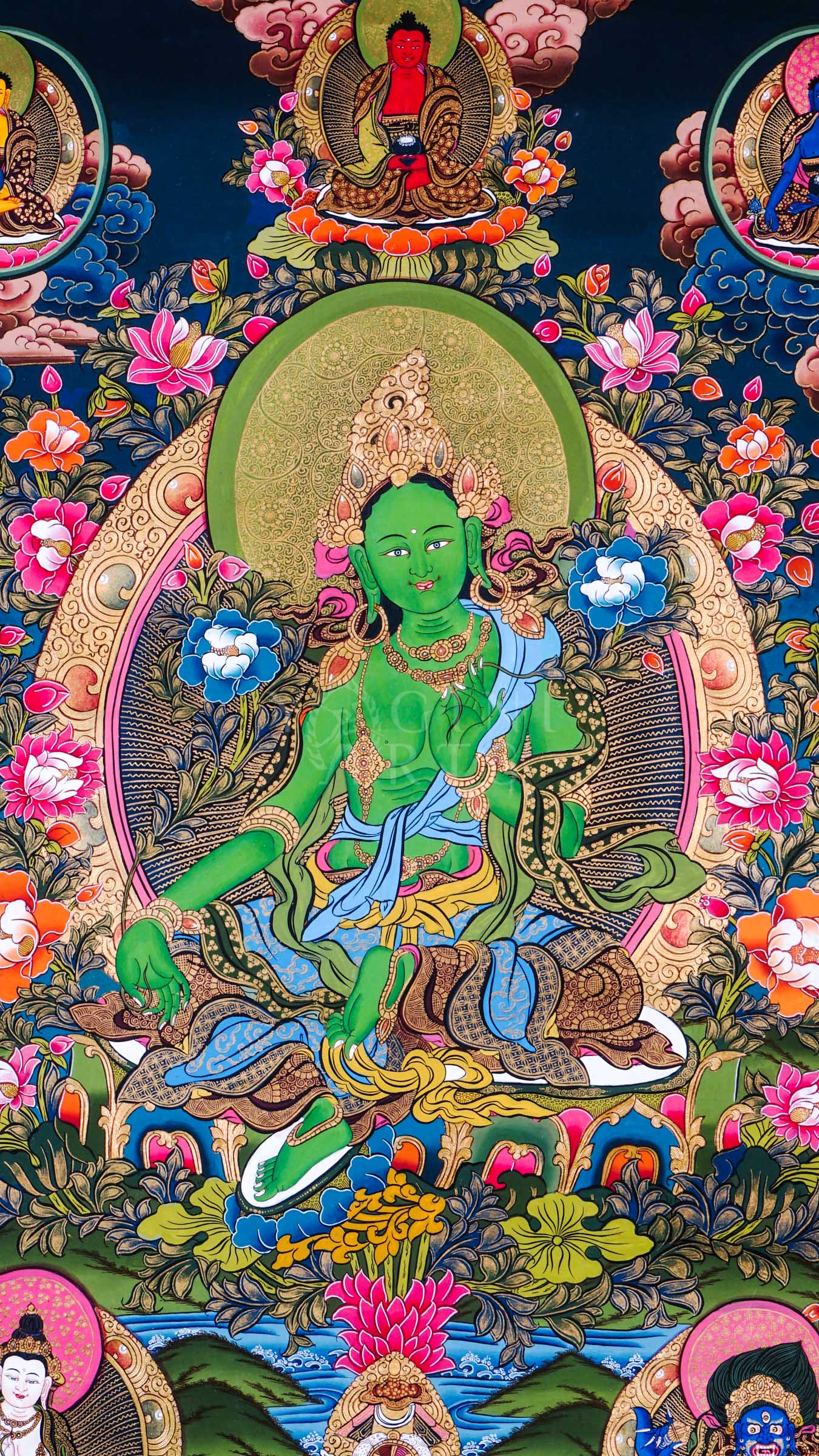Green Tara thangka featuring the Buddhist goddess of compassion seated among vibrant flowers with celestial Buddhas and protector deities