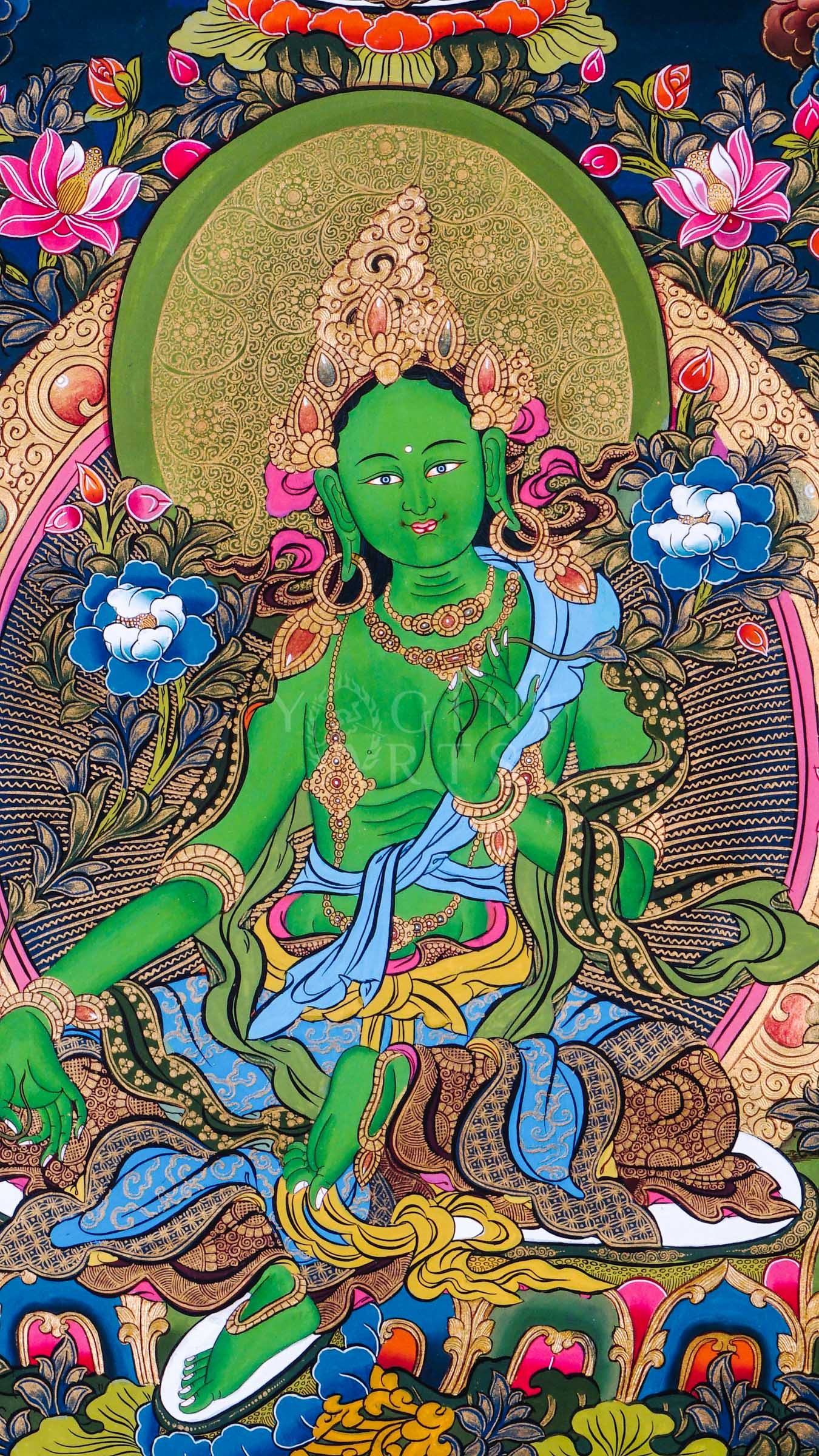 Green Tara thangka featuring the Buddhist goddess of compassion seated among vibrant flowers with celestial Buddhas and protector deities