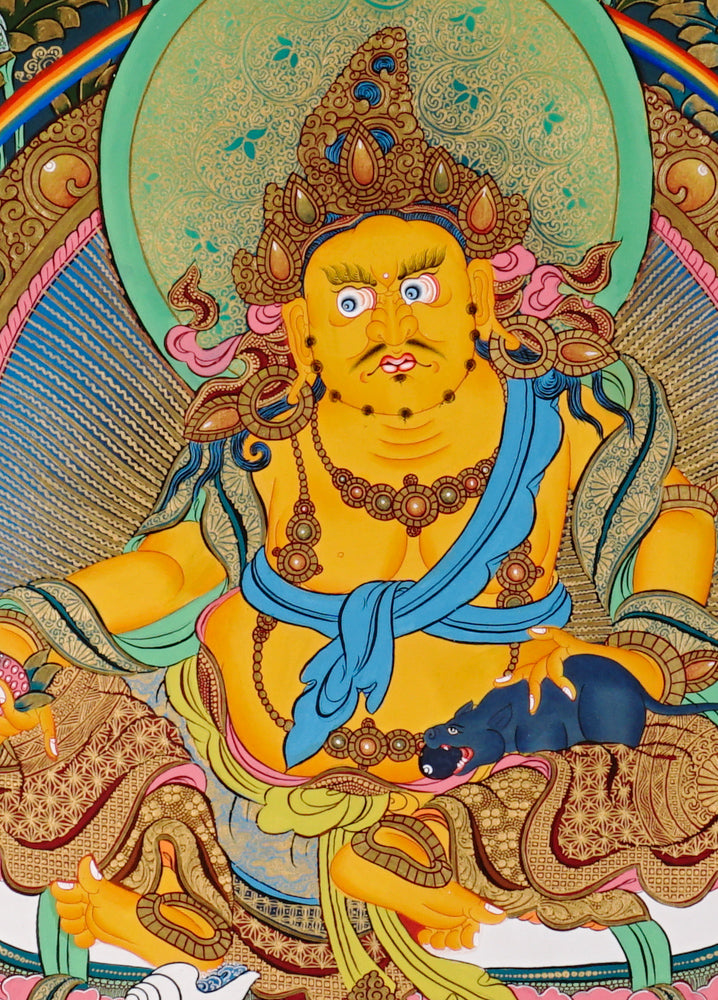Hand-painted Yellow Zambhala thangka showing wealth deity seated on lotus with mongoose and rainbow halo.