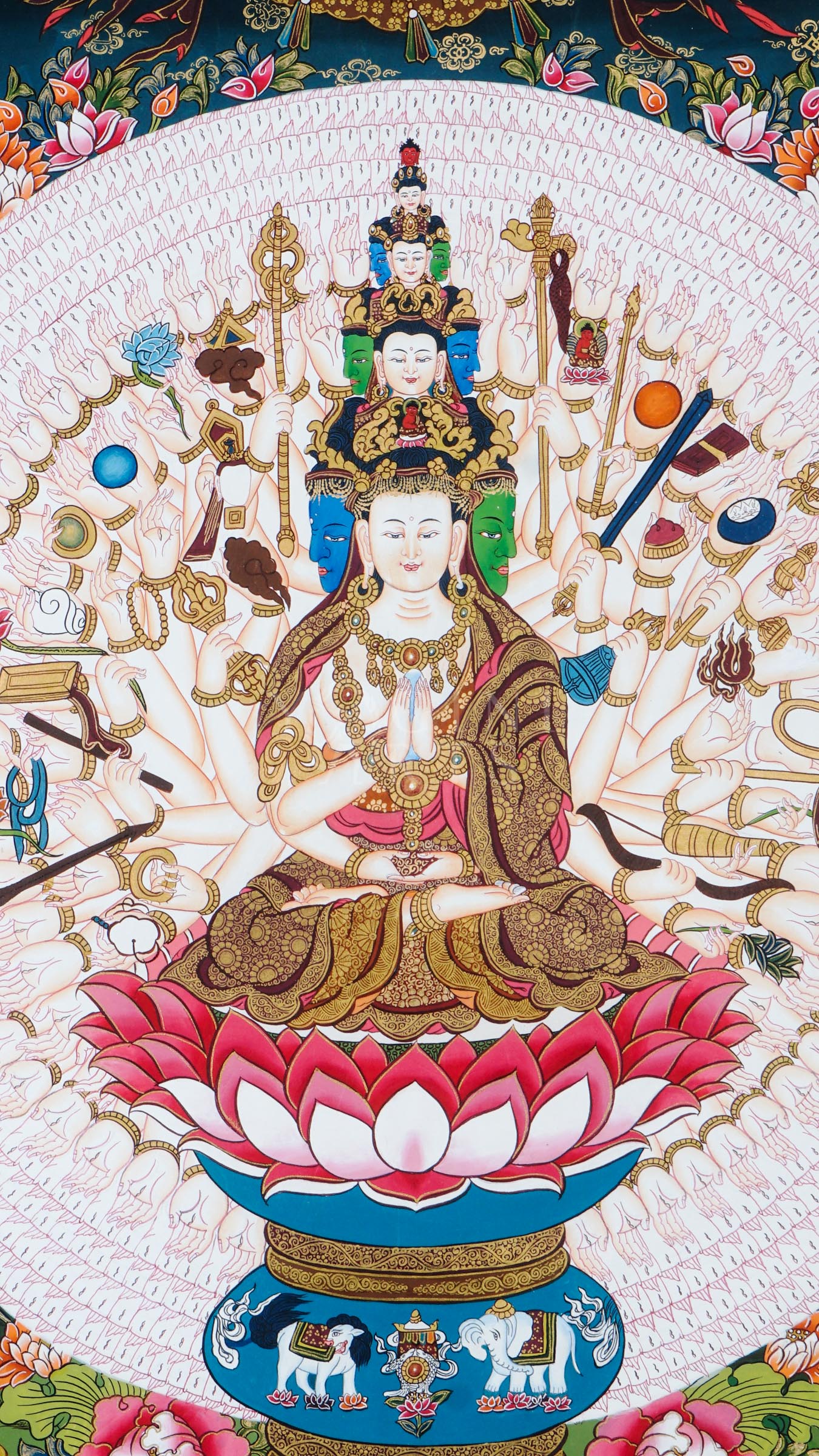 Hand-painted Tibetan thangka of Thousand-Armed Avalokiteshvara seated on a lotus throne surrounded by countless sacred arms, ritual implements, and traditional Himalayan Buddhist ornamentation.