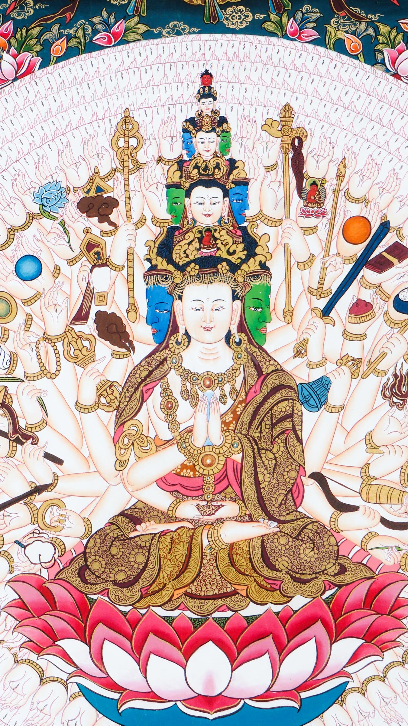 Hand-painted Tibetan thangka of Thousand-Armed Avalokiteshvara seated on a lotus throne surrounded by countless sacred arms, ritual implements, and traditional Himalayan Buddhist ornamentation.