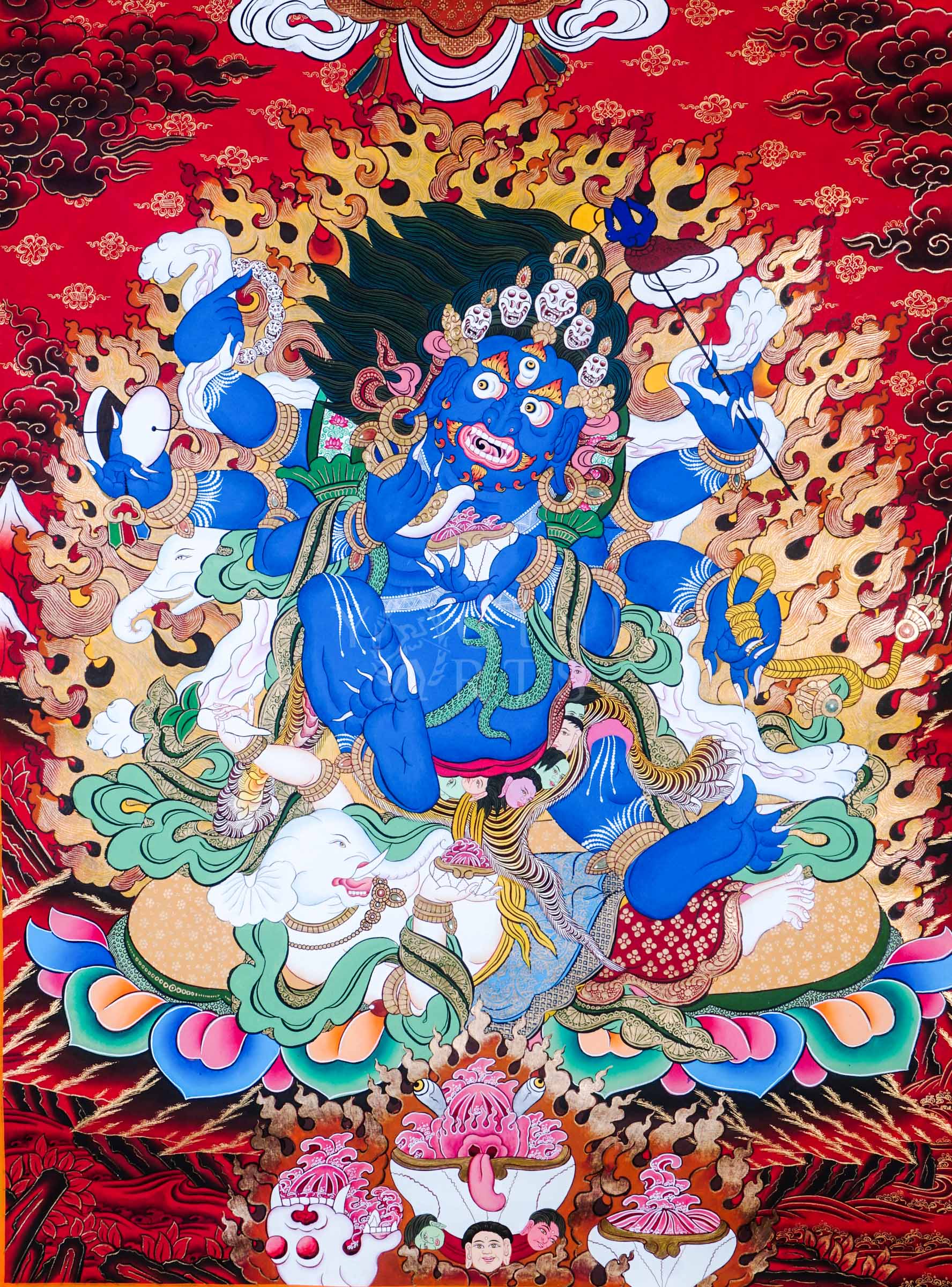 Hand-painted Tibetan thangka of Six-Armed Mahakala surrounded by blazing wisdom flames, holding sacred tantric implements against a vivid red Himalayan background.