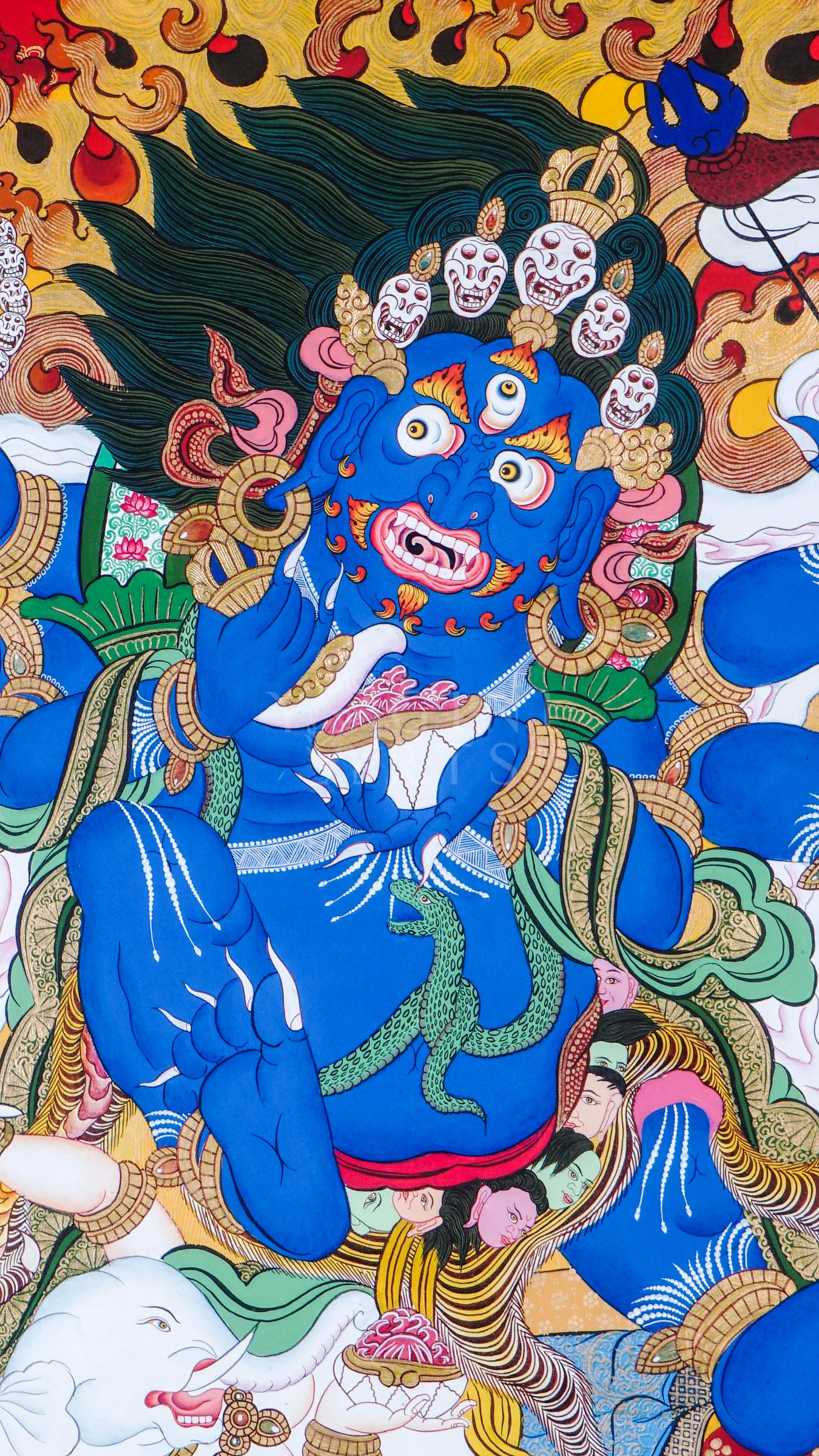 Hand-painted Tibetan thangka of Six-Armed Mahakala surrounded by blazing wisdom flames, holding sacred tantric implements against a vivid red Himalayan background.