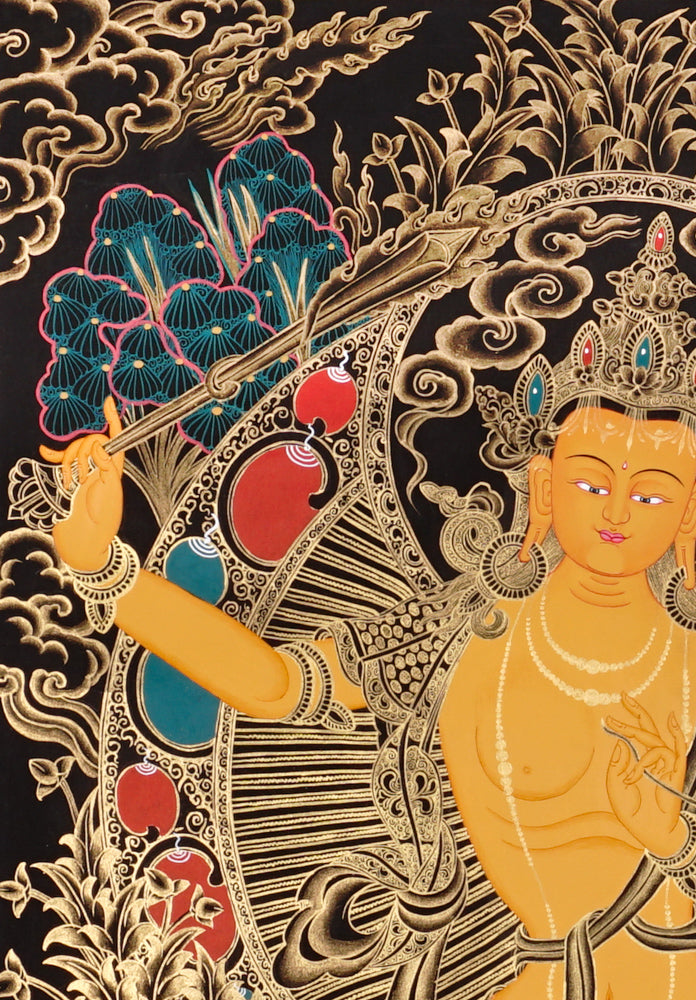 Gold-on-black Manjushri thangka holding the flaming sword of wisdom and lotus scripture.