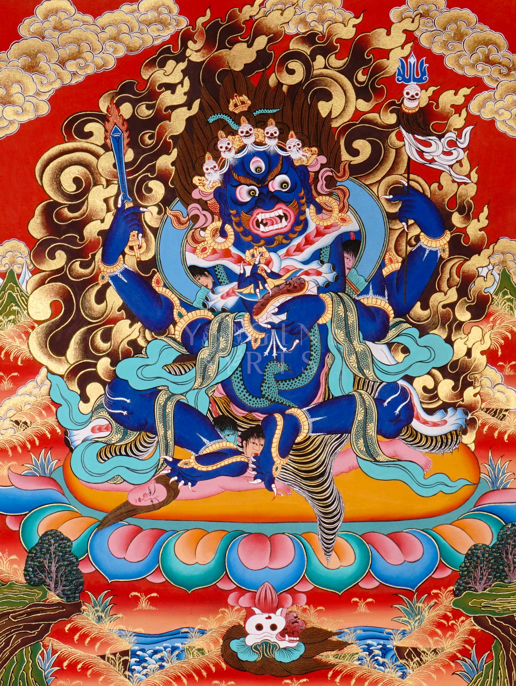 Mahakala thangka showing a fierce blue wrathful deity with multiple arms, surrounded by flames and standing on subdued figures in traditional Tibetan style.