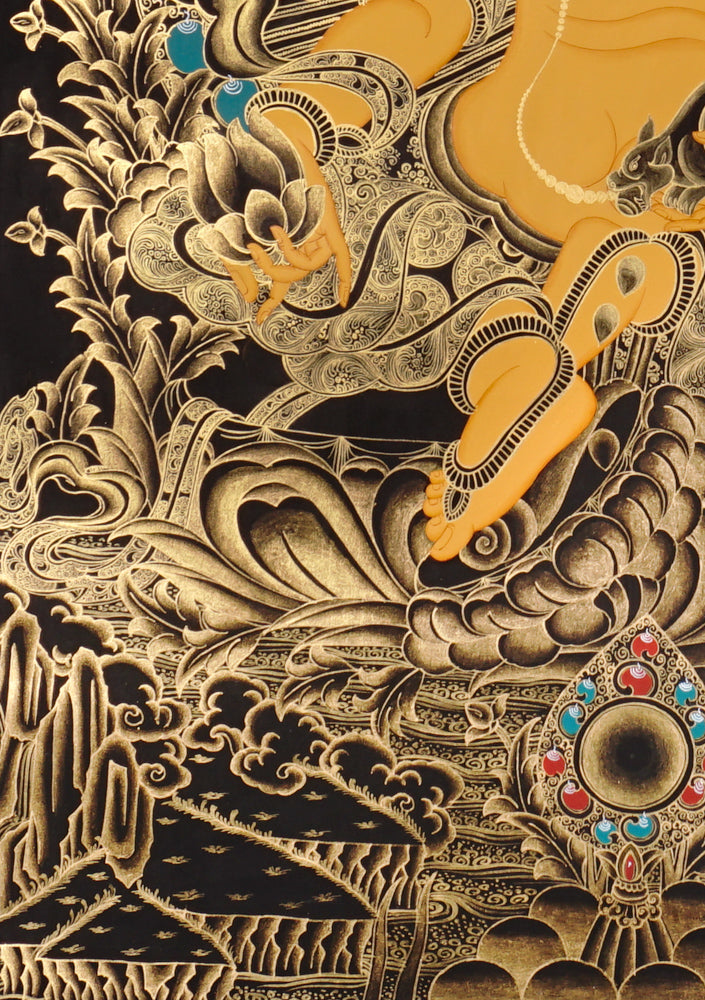 Gold-on-black Zambhala thangka depicting the Buddhist wealth deity holding a jewel and a jewel-spitting mongoose.