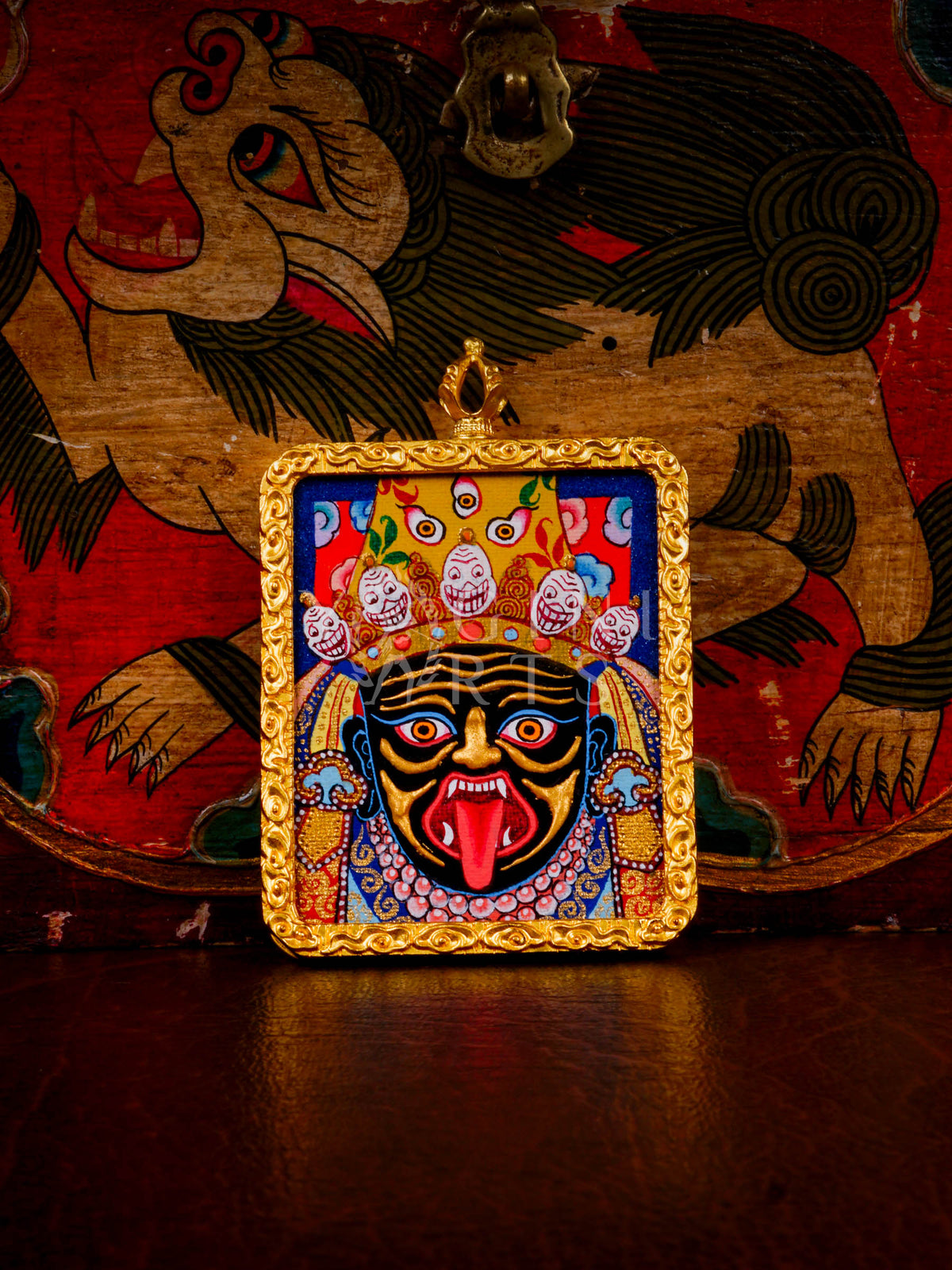 Hand-painted Zhaji Lhamo Ghau pendant in a gold-tone frame, handcrafted in Nepal using traditional Tibetan miniature painting techniques.