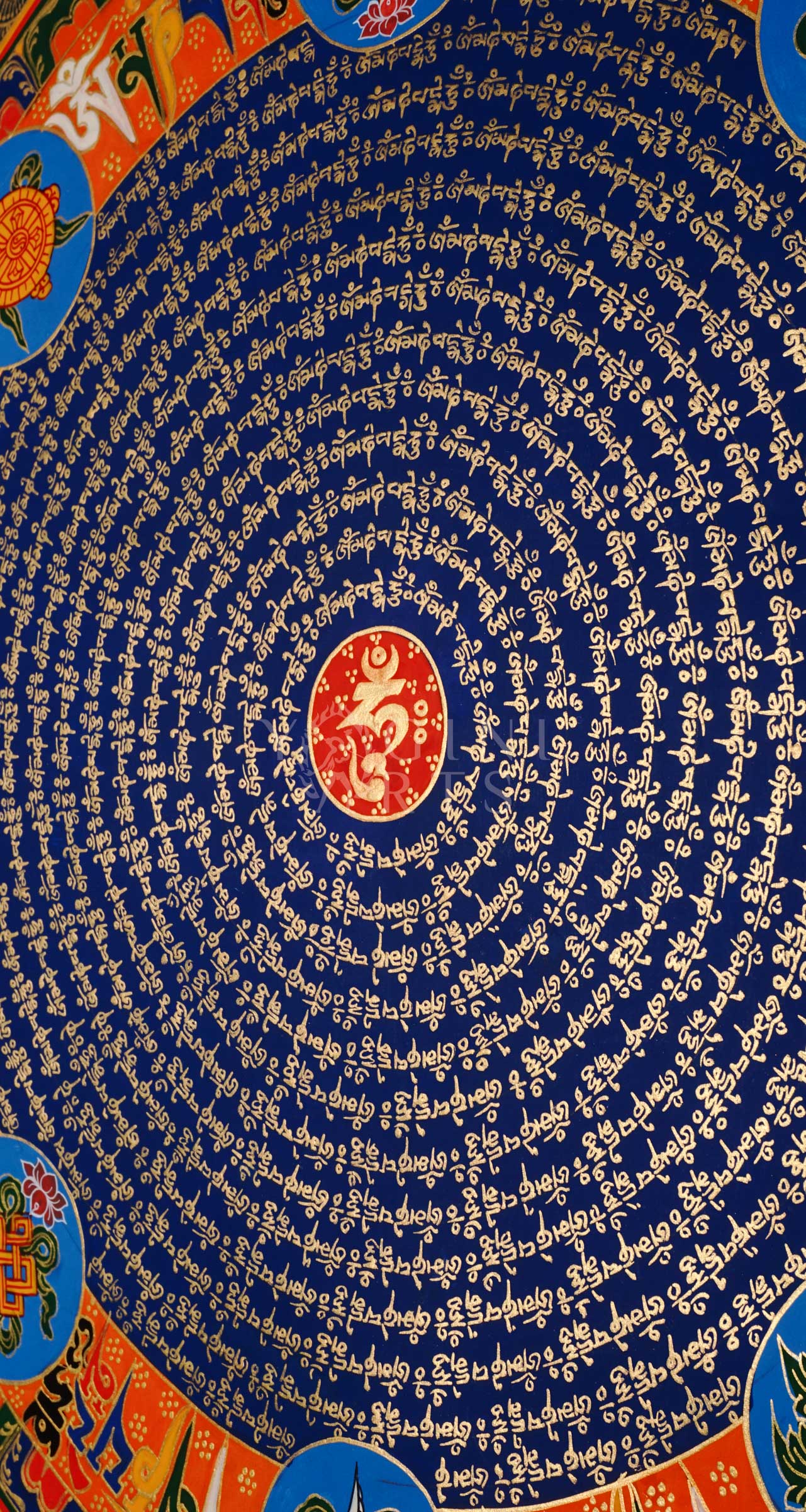 Tibetan mantra mandala thangka with blue center, gold script rings, orange band featuring eight auspicious symbols, and ornate golden border.