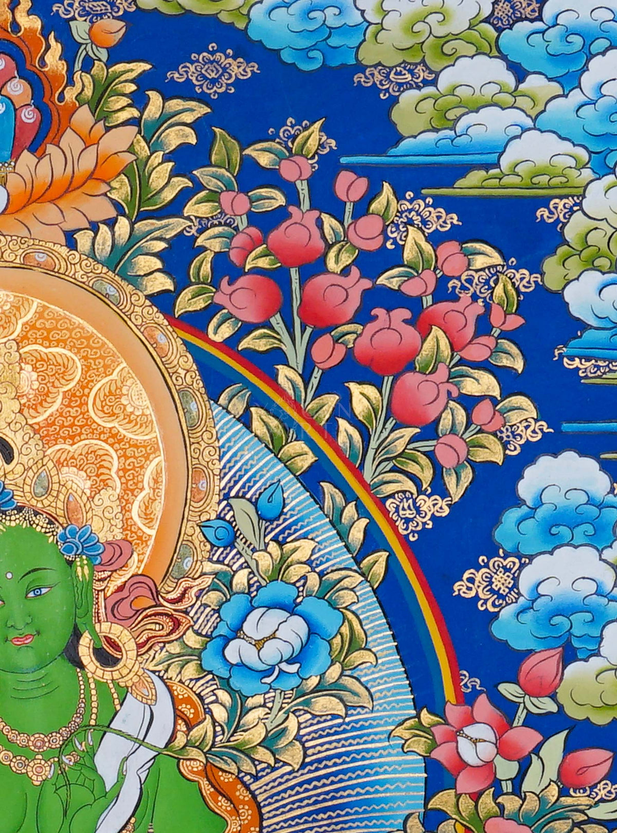 Green Tara Thangka painting depicting Green Tara seated on a lotus throne surrounded by flowers, clouds and intricate traditional Tibetan Buddhist artwork from Nepal